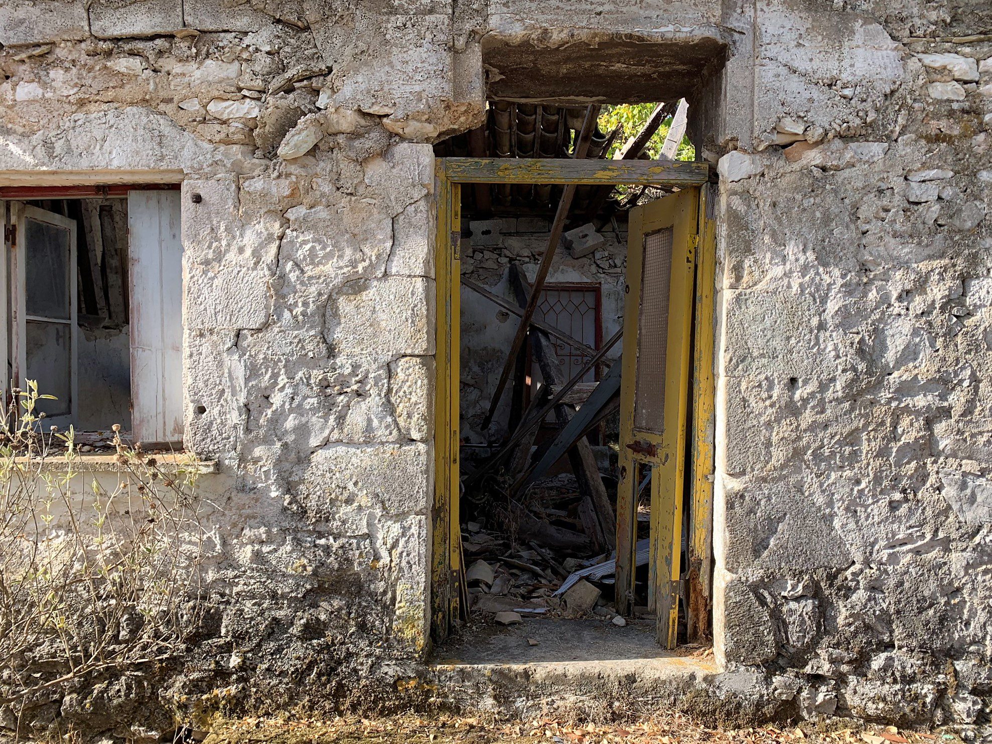 Exterior facade of ruin with house for sale in Ithaca Greece, Pilikata