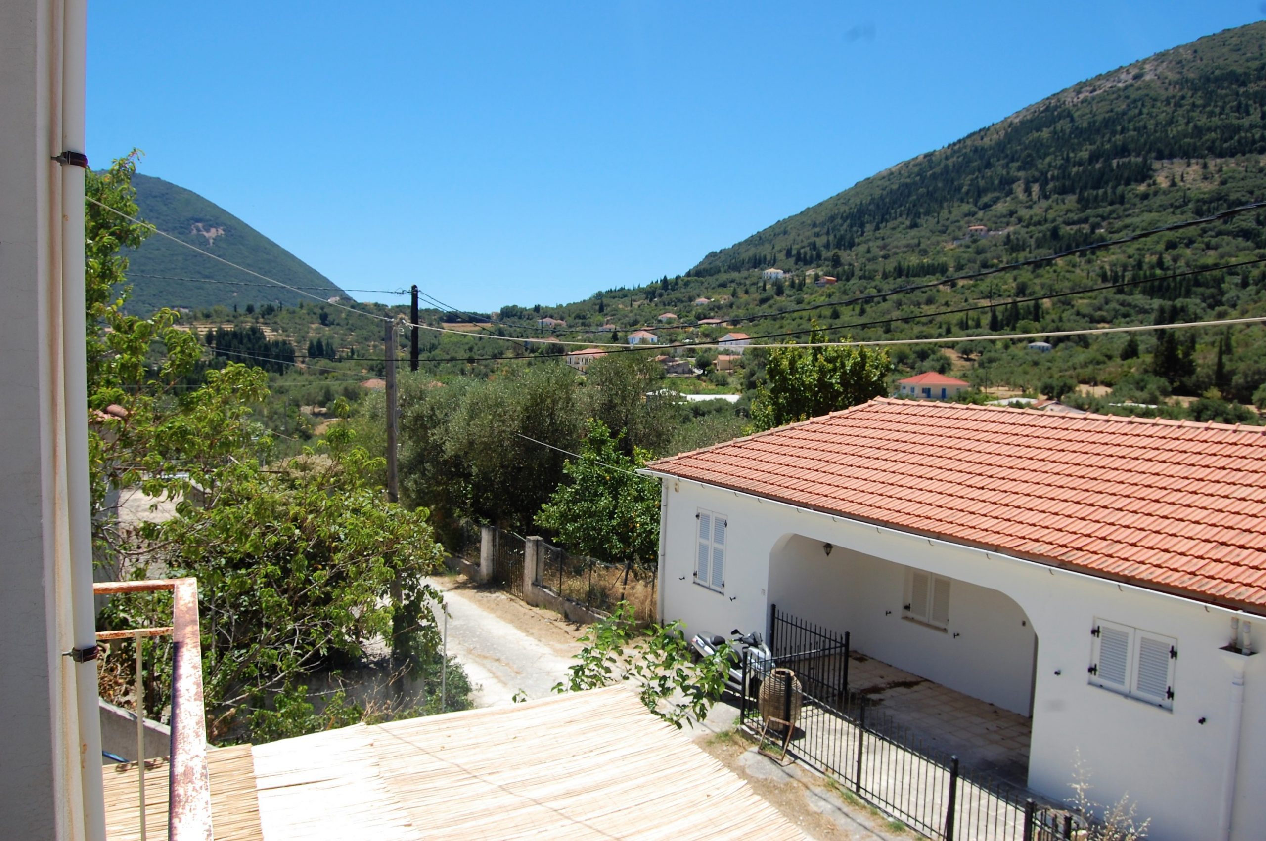 Village view of house for sale Ithaca Greece Platrithya
