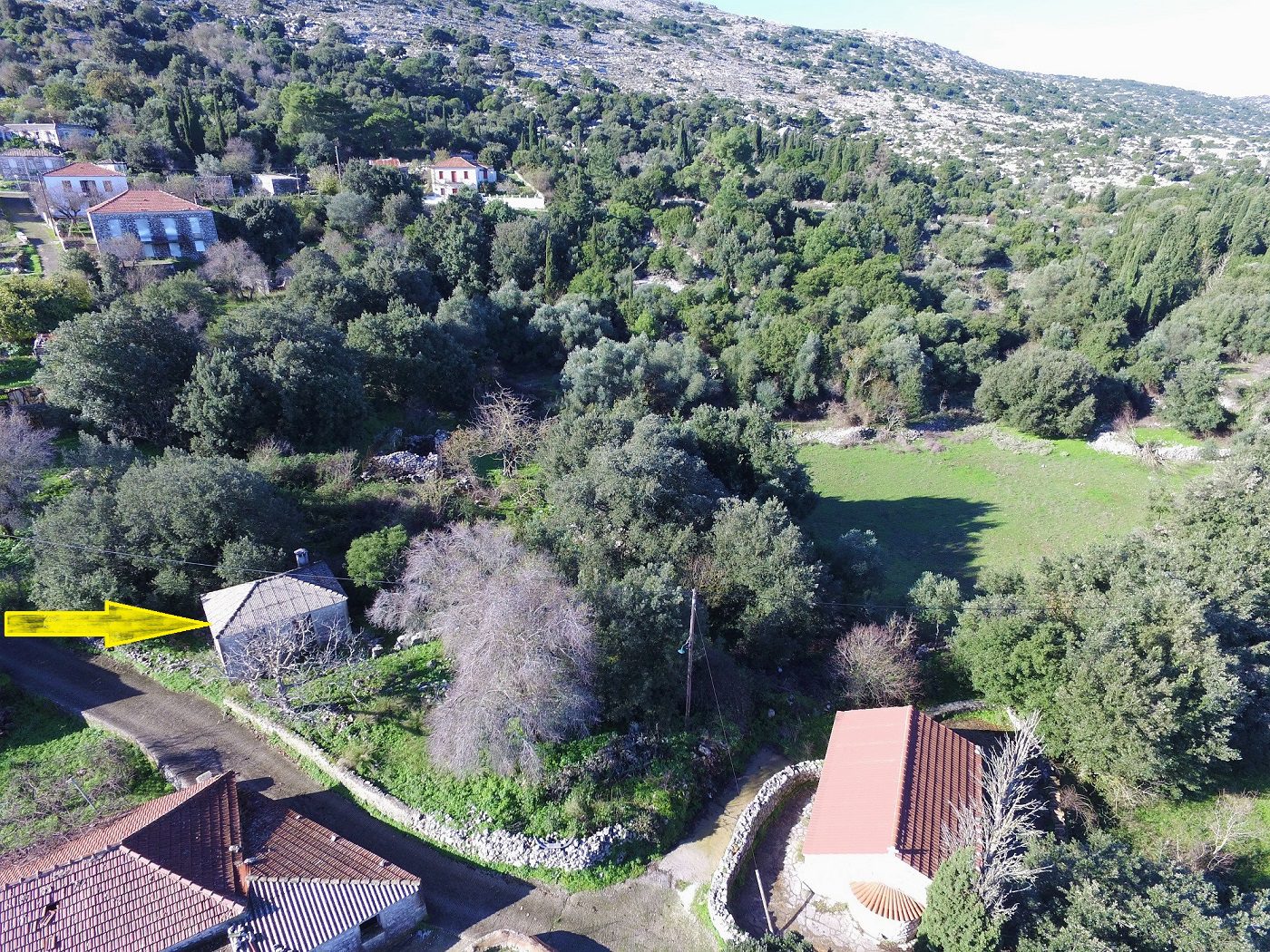 Aerial view of land with house for sale in Ithaca Greece