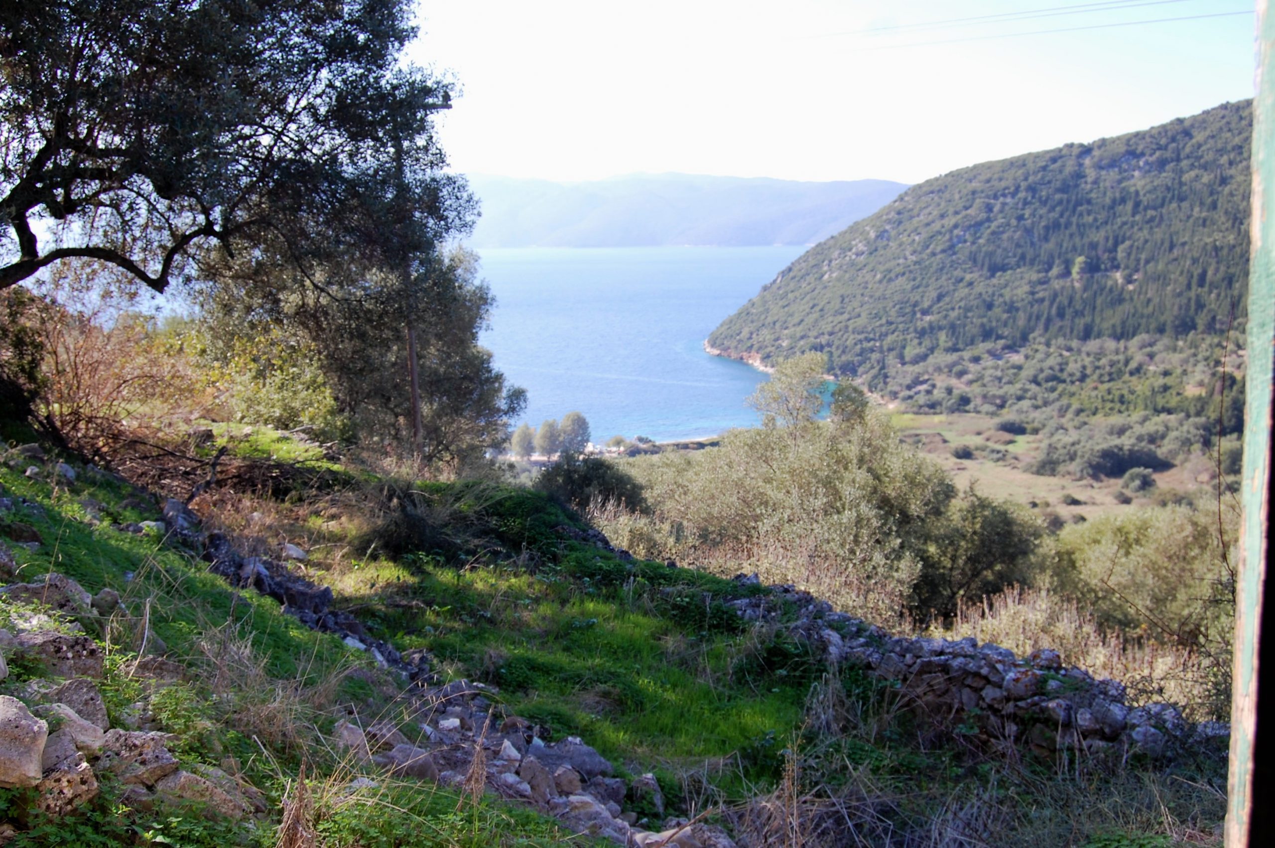 Exterior view of land with house for sale on Ithaca Greece