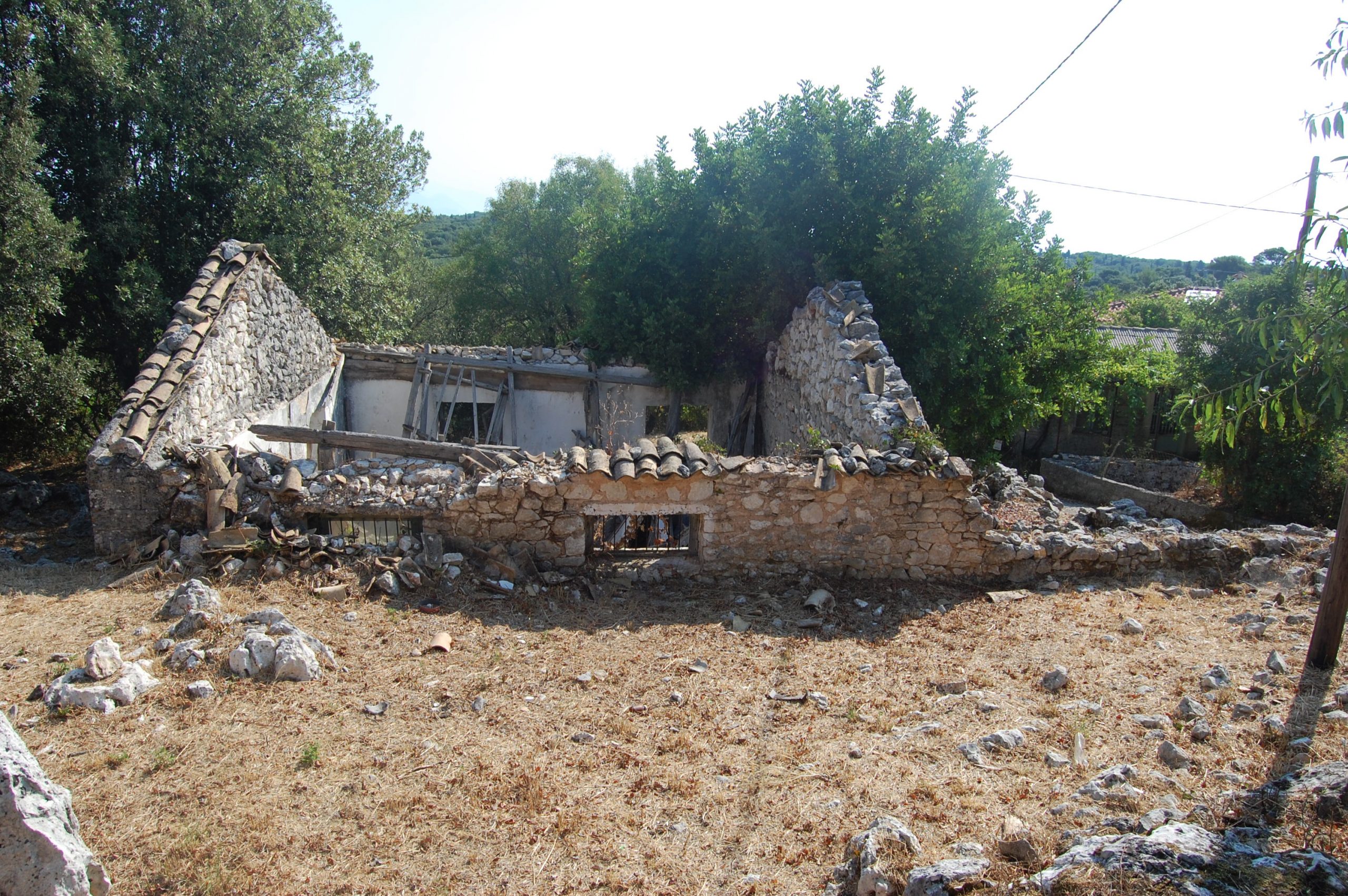 Exterior view of ruins and house for sale in Ithaca Greece