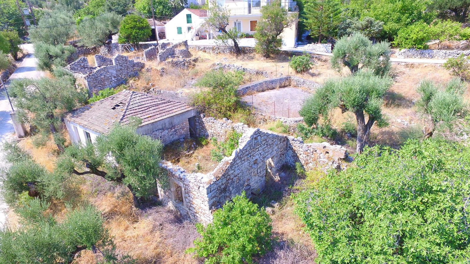 Aerial view of house and ruins for sale in Ithaca Greece Perachori