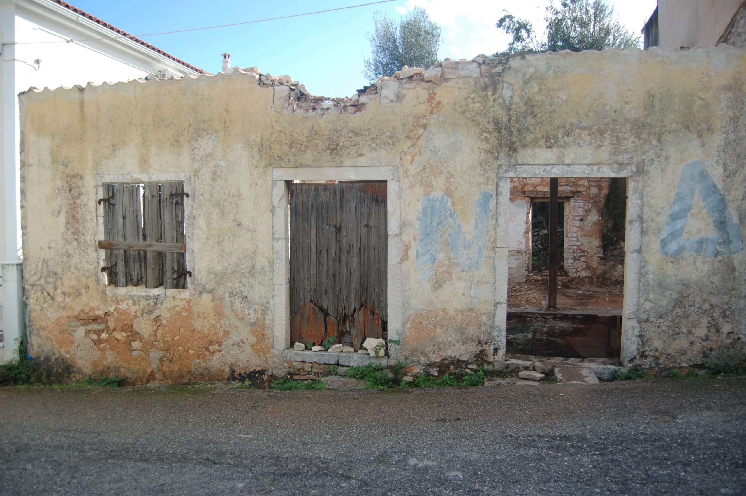 Exterior facade of ruin for sale in Ithaca Greece, Vathi