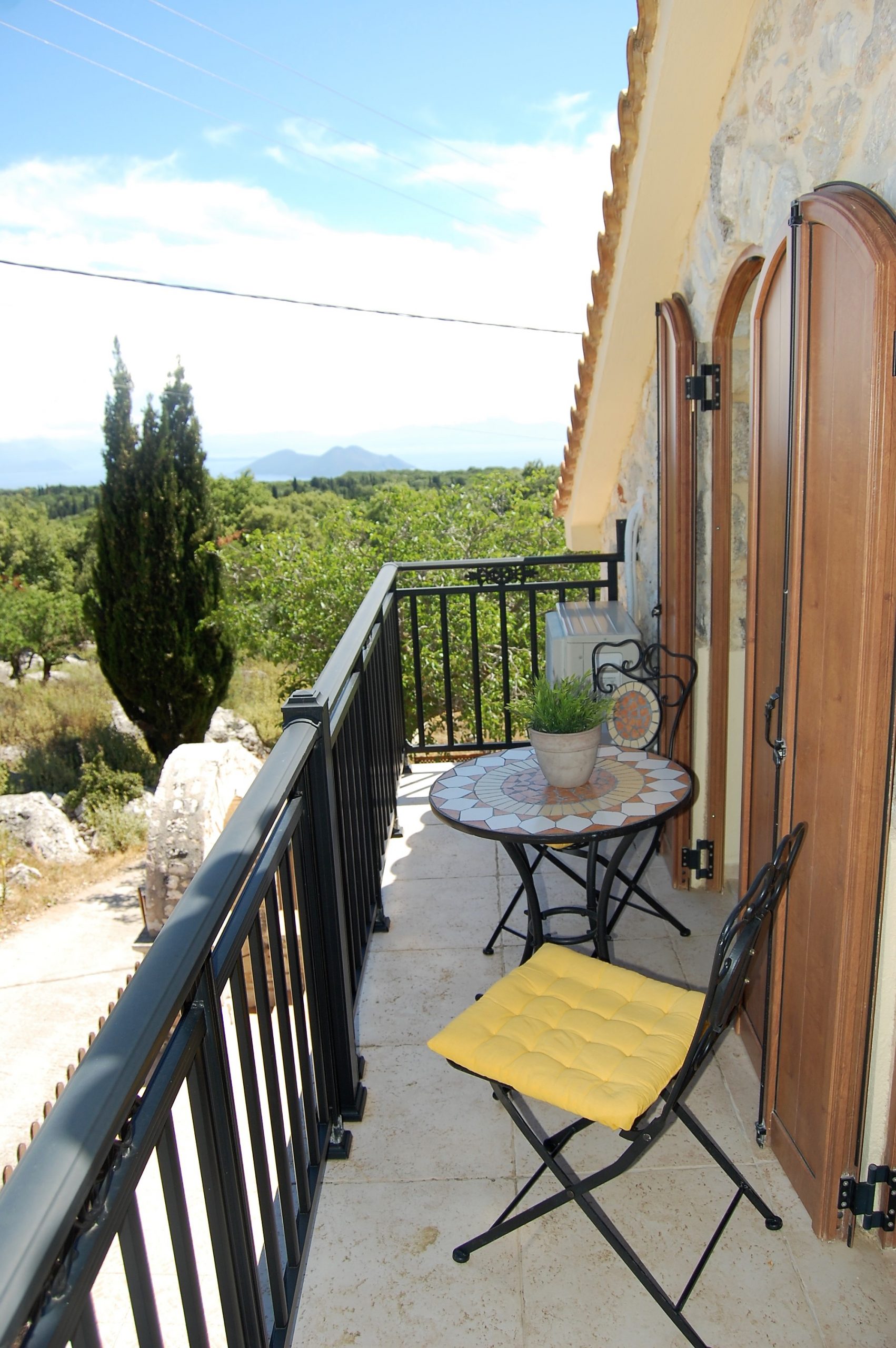 Top level balcony overlooking landscape of stone house for rent Ithaca Greece