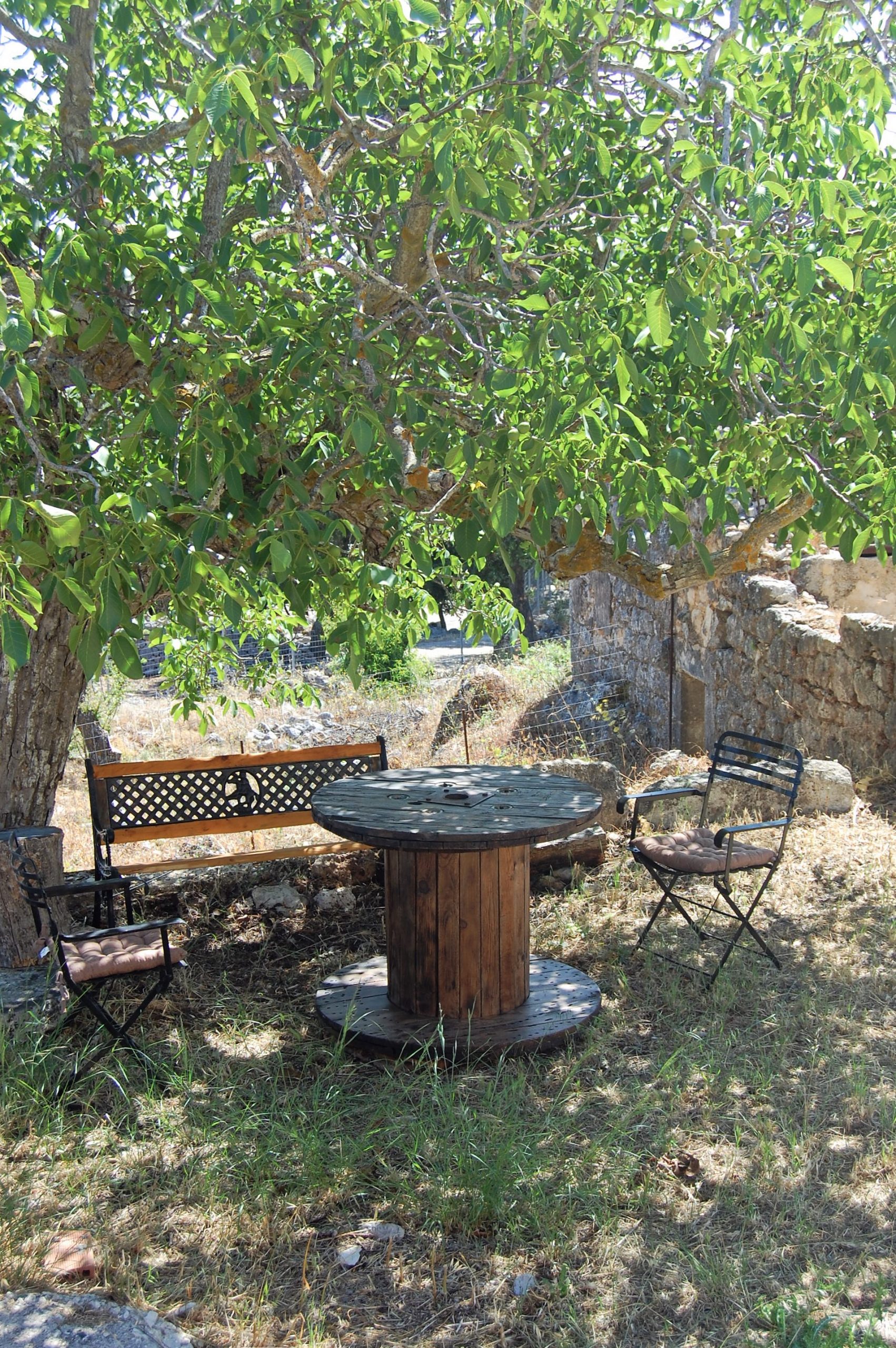 Outdoor seating area of stone house for rent Ithaca Greece