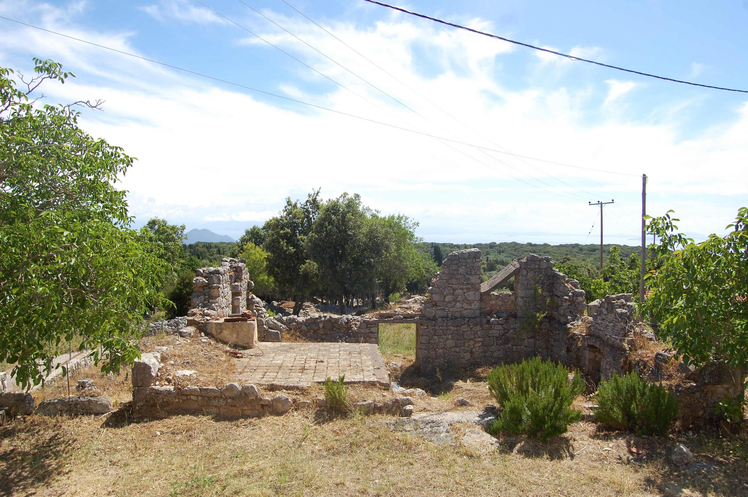 Outdoor are of ruin next to stone house for rent Ithaca Greece