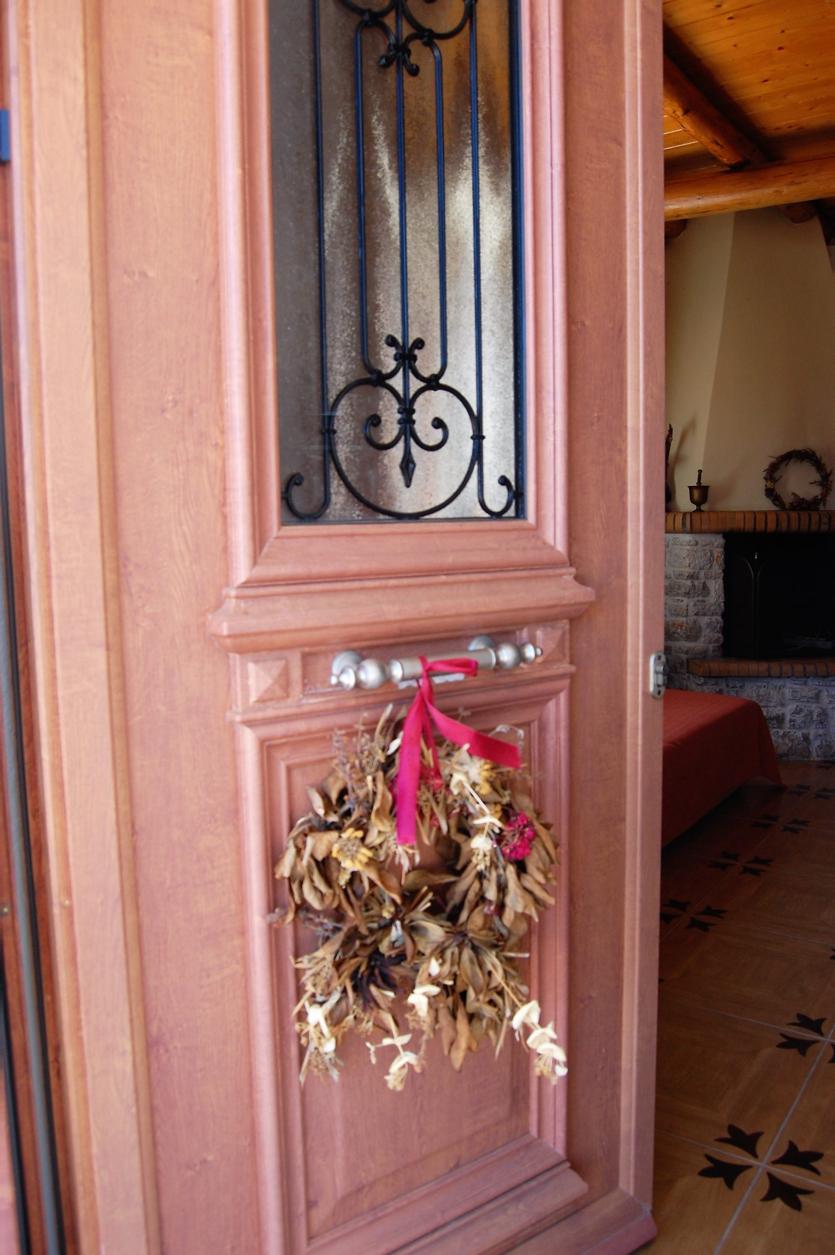 Decorative front door of stone house for rent Ithaca Greece