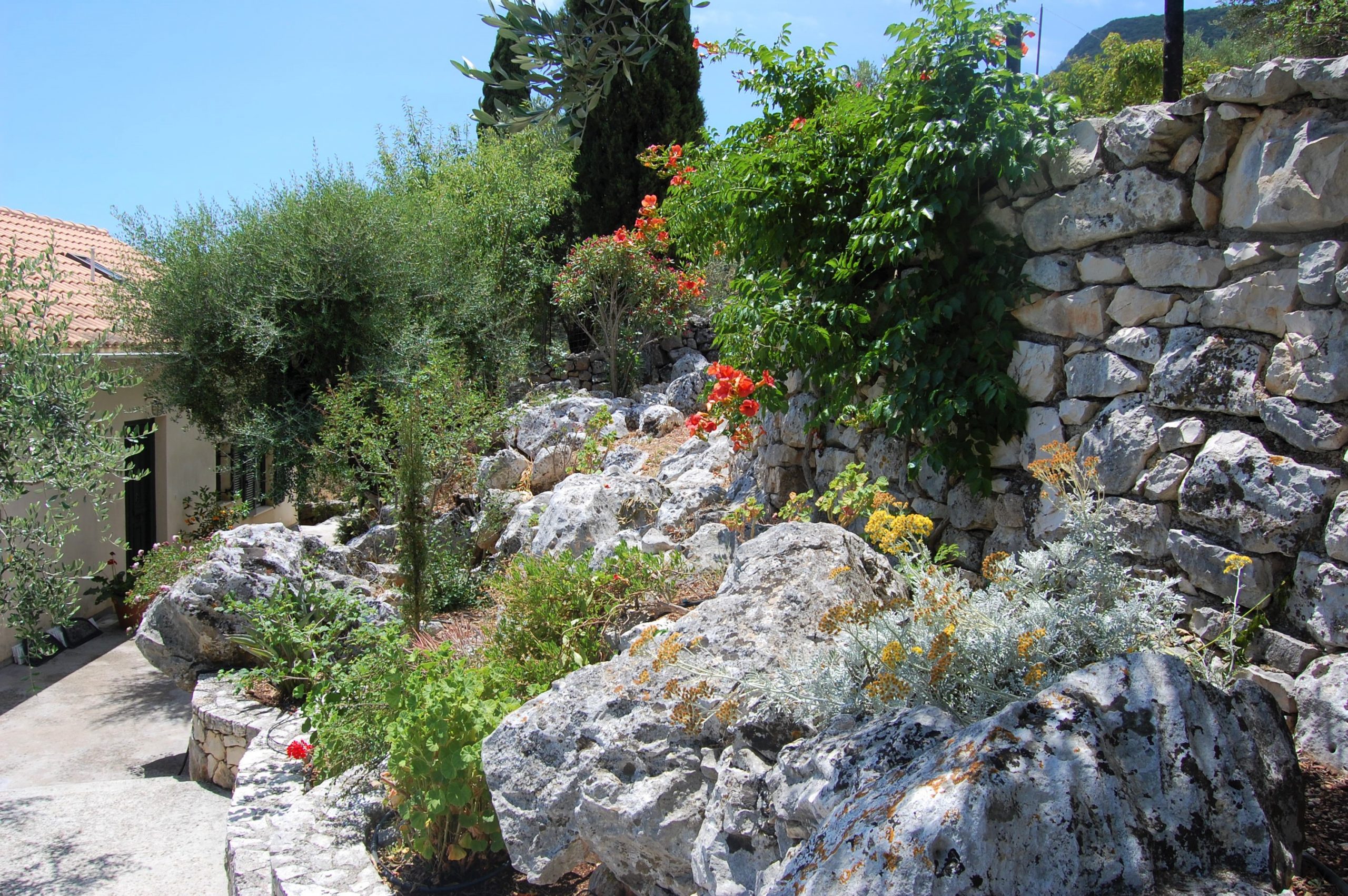 Stone rockery garden of house for sale Ithaca Greece