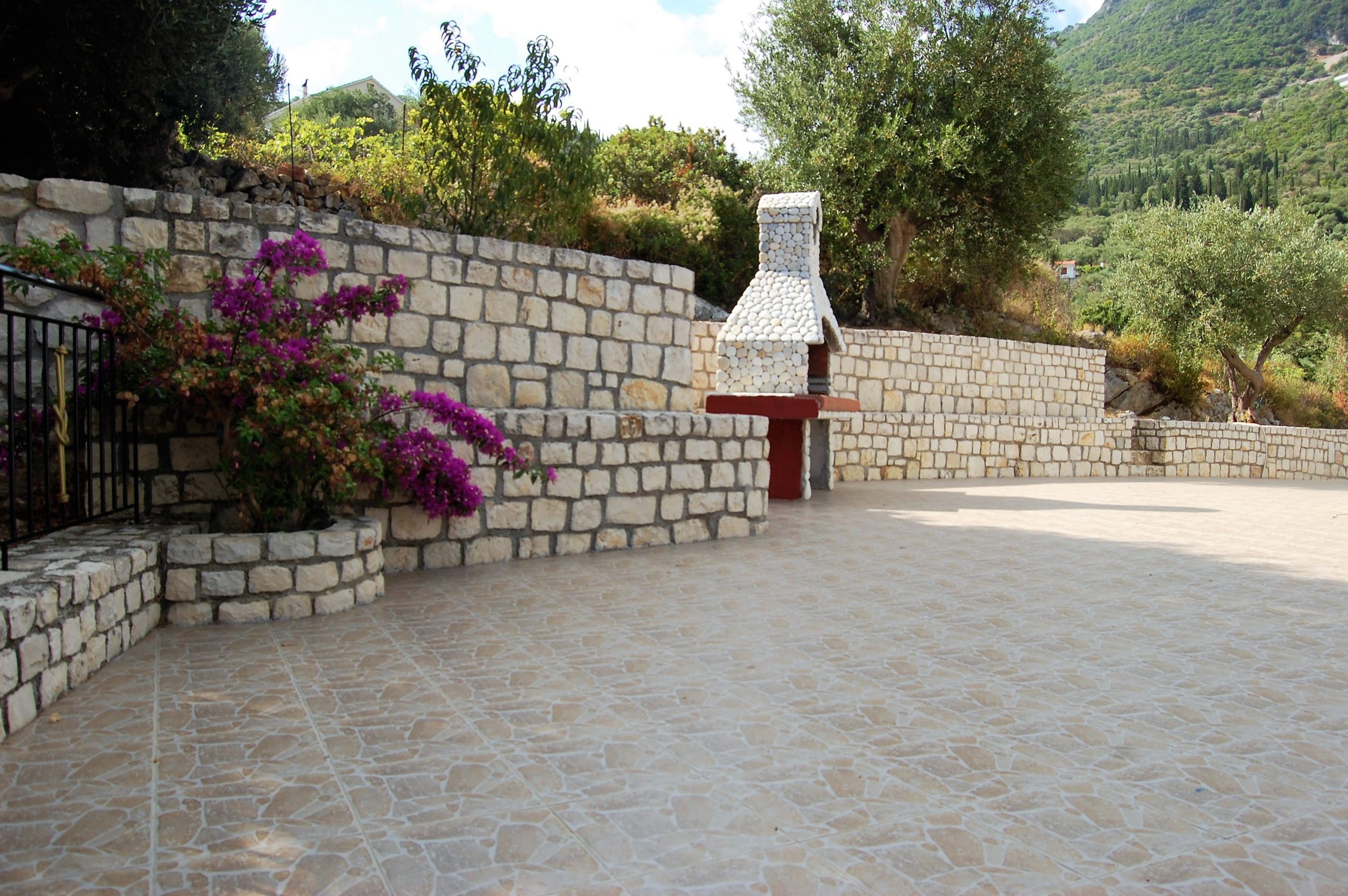 Outside patio area and barbecue of property for sale in Ithaca Greece Vathi