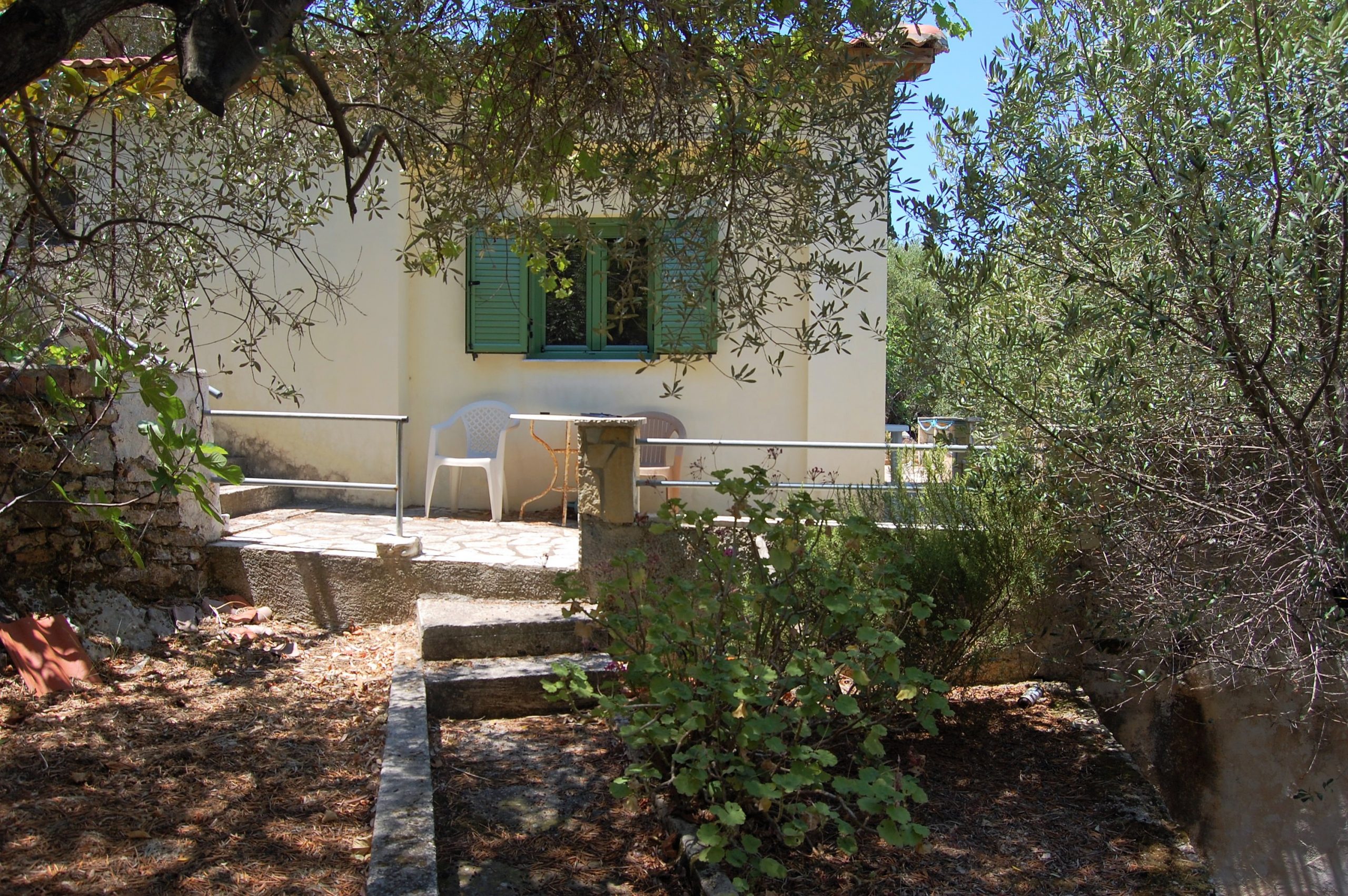 Exterior and terrace of coastal house for sale in Ithaca Greece Vathi