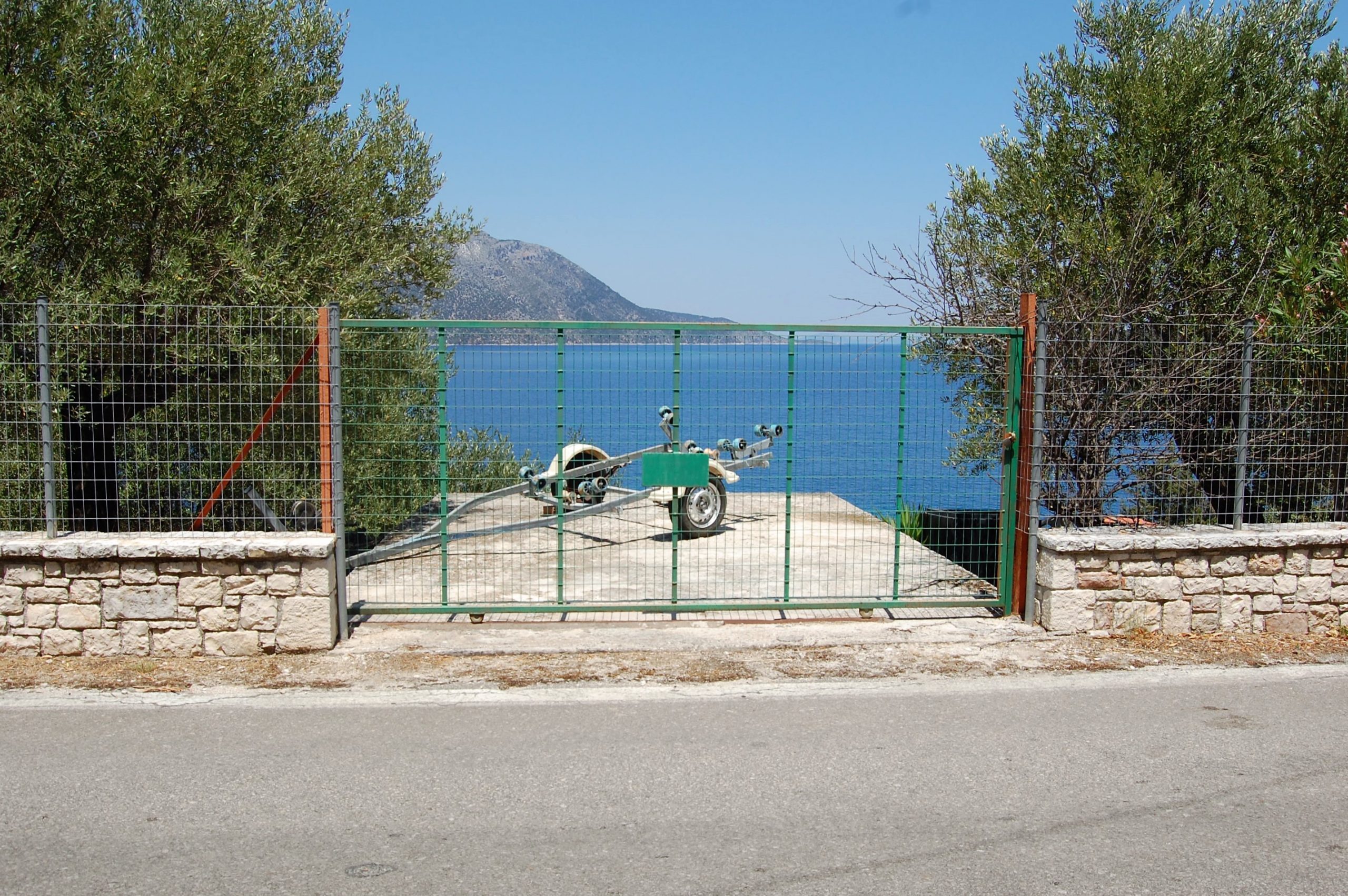 Exterior and terrace of coastal house for sale in Ithaca Greece Vathi