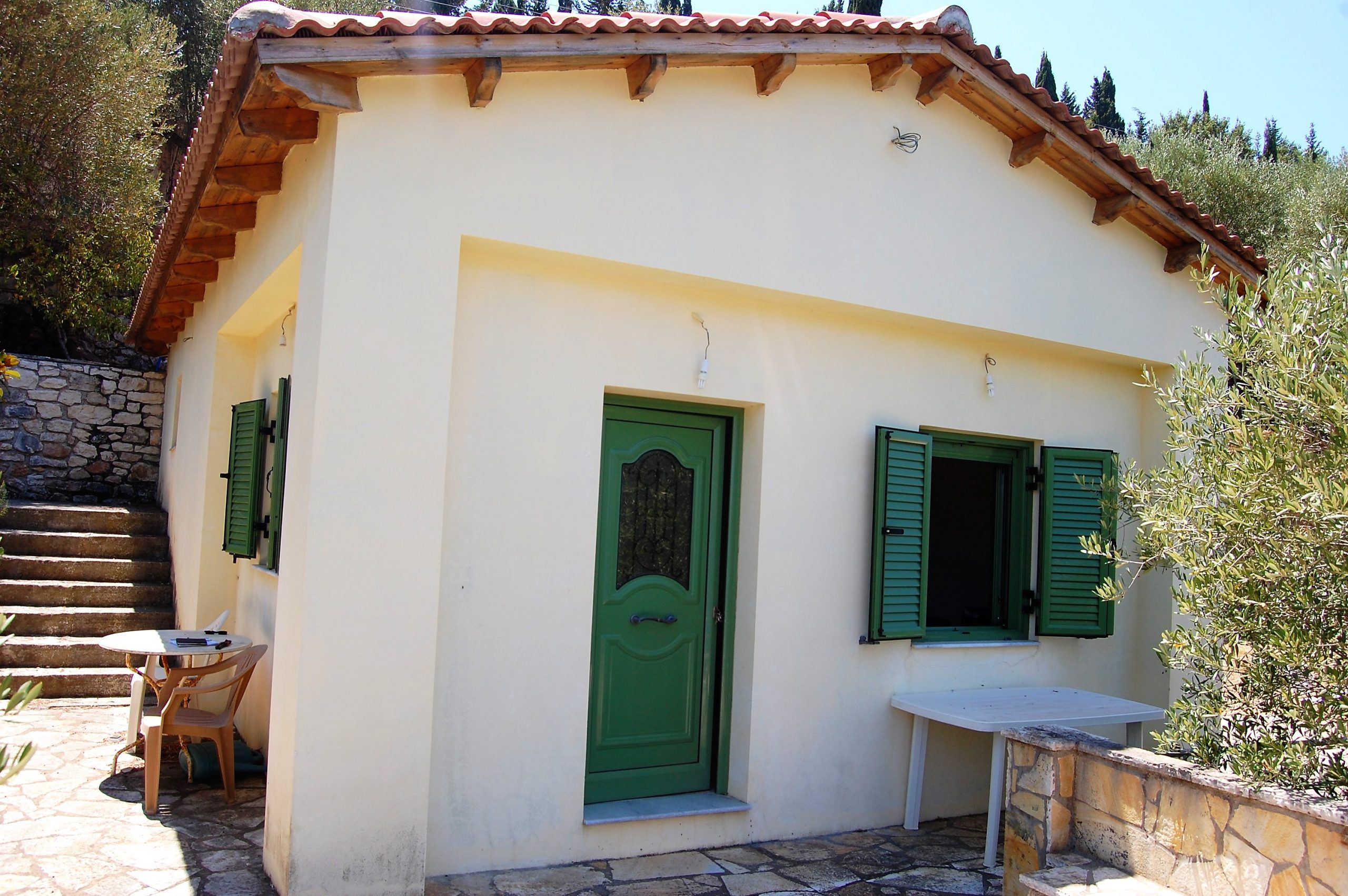 Exterior and terrace of coastal house for sale in Ithaca Greece Vathi