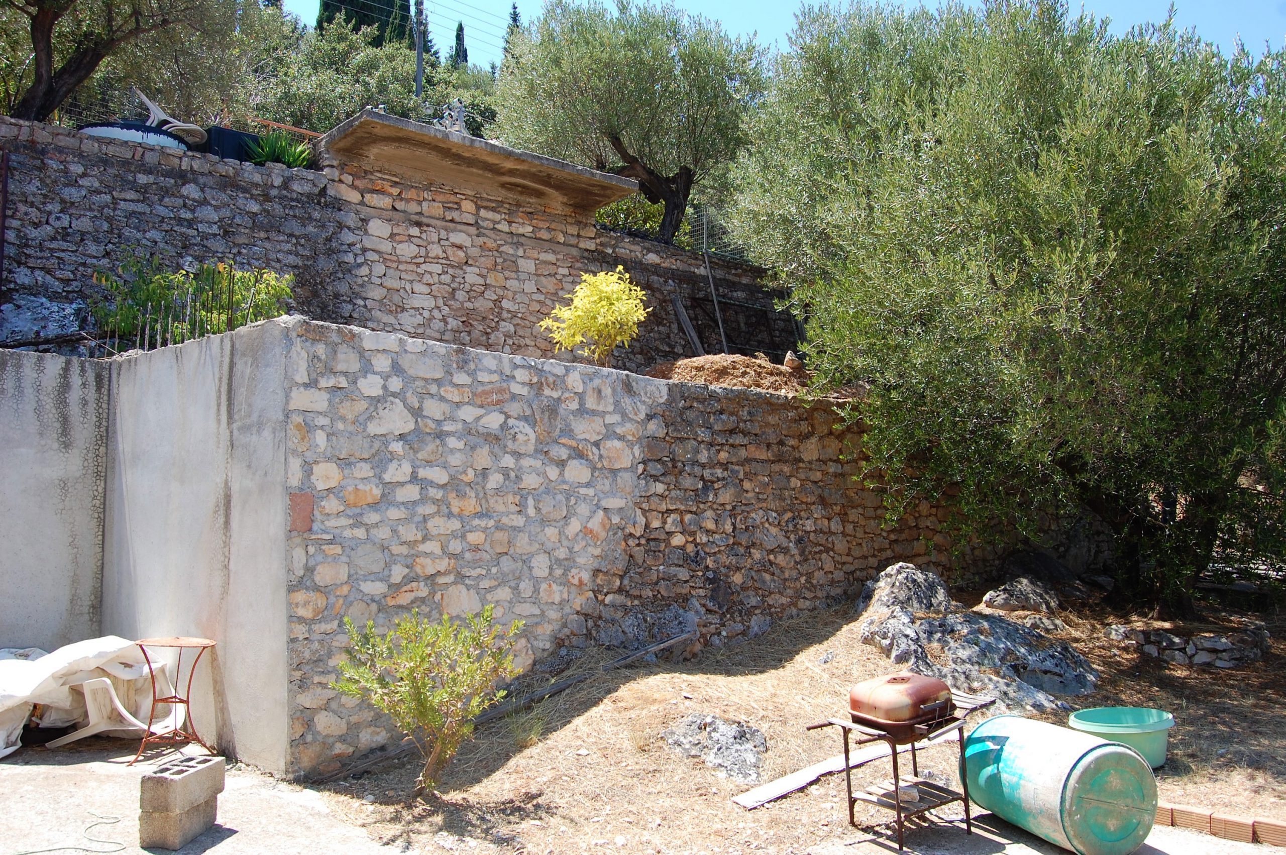 Exterior and terrace of coastal house for sale in Ithaca Greece Vathi