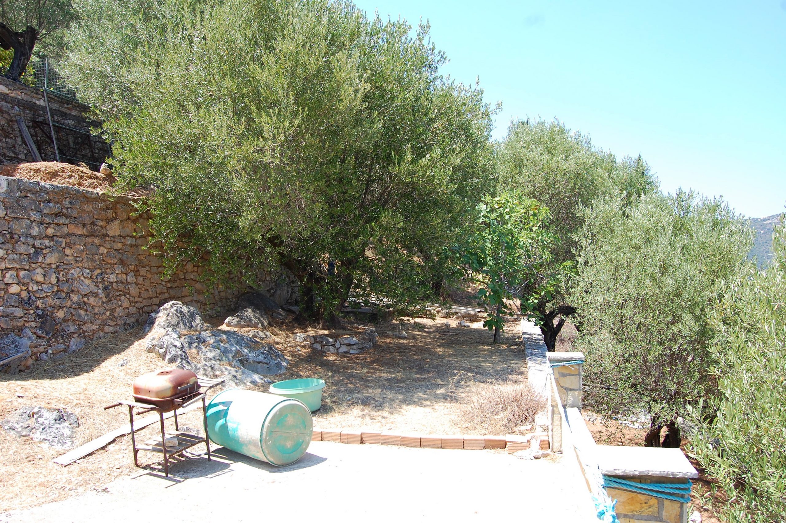 Exterior and terrace of coastal house for sale in Ithaca Greece Vathi