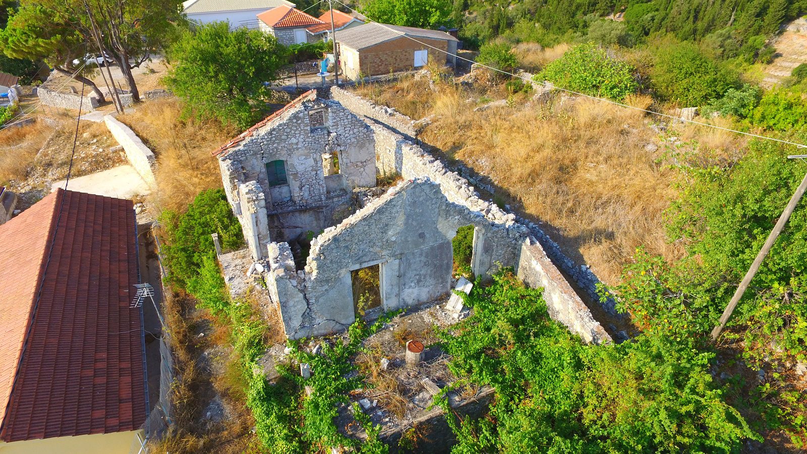 Aerial view of exterior facade of ruins for sale in Ithaca Greece Exogi