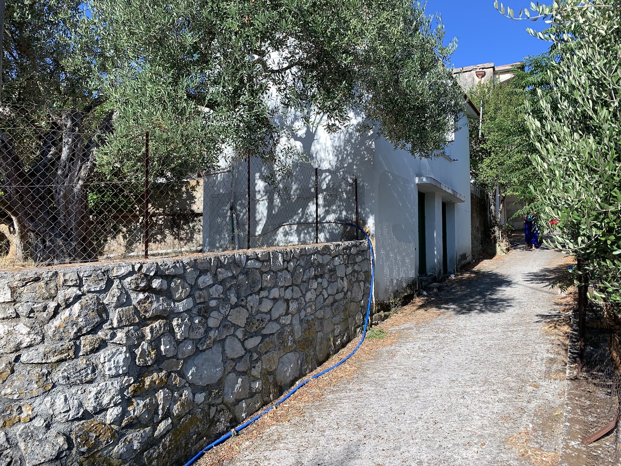 Boundary wall with pathway of house for sale in Ithaca Greece, Stavros