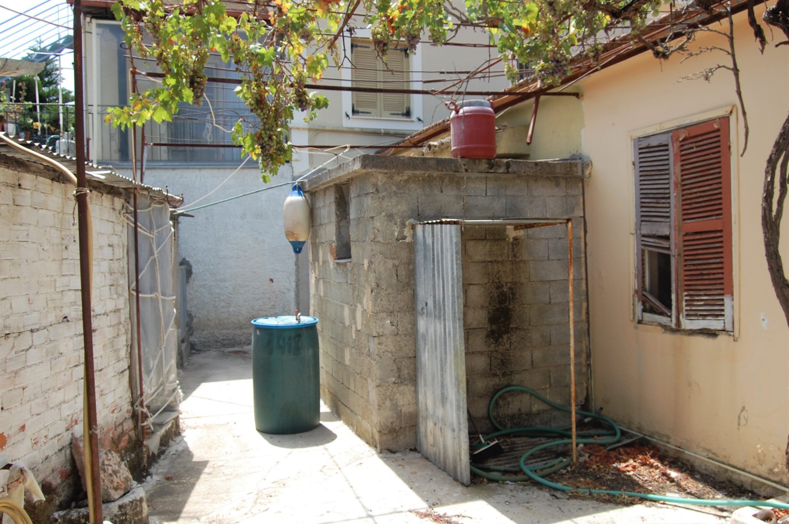 Back outside space of house for sale Ithaca Greece, Vathi