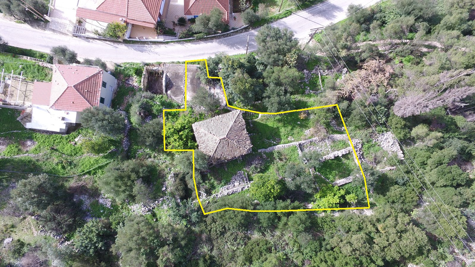 Aerial view with border of house with ruin for sale in Ithaca Greece Lefki