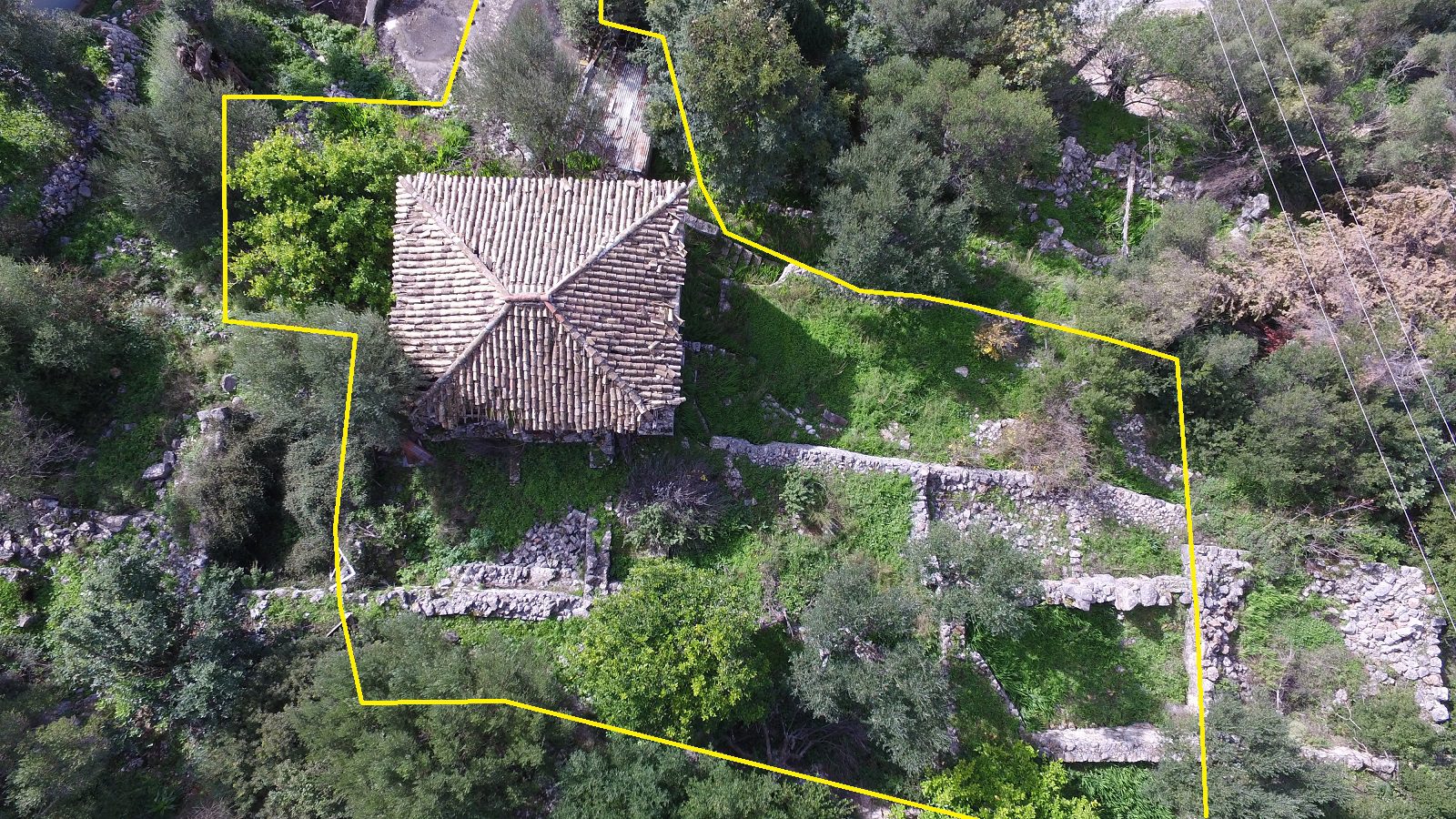 Aerial view with border of house with ruin for sale in Ithaca Greece Lefki