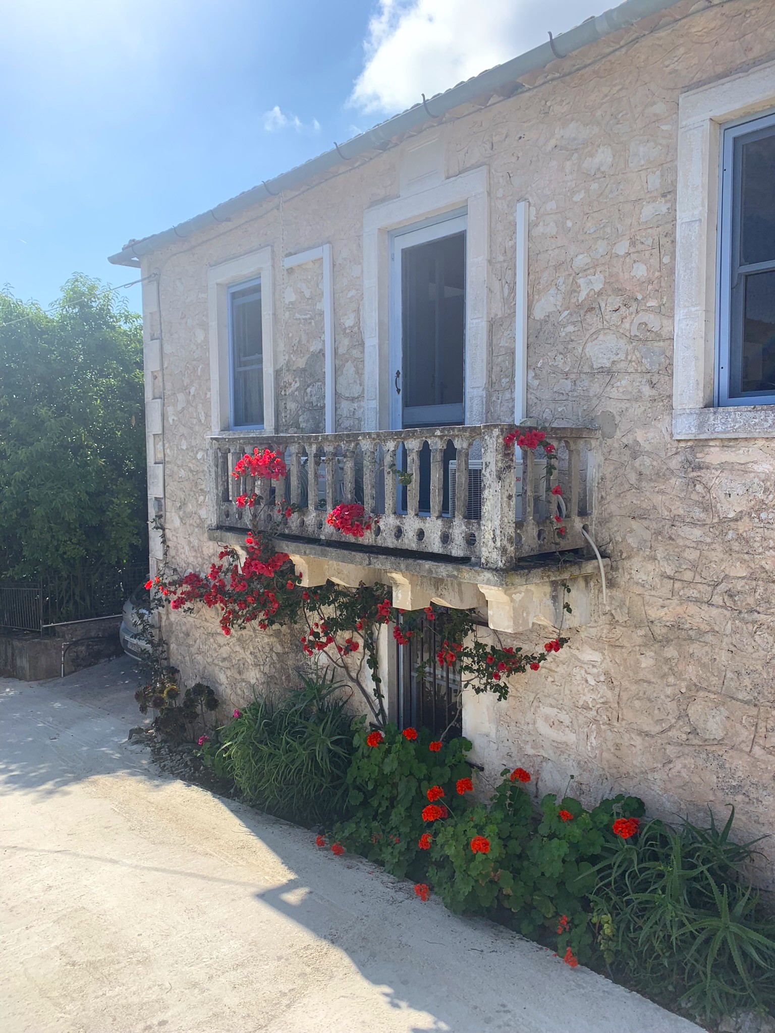 Facade with balcony of house for sale in Ithaca Greece, Lahos