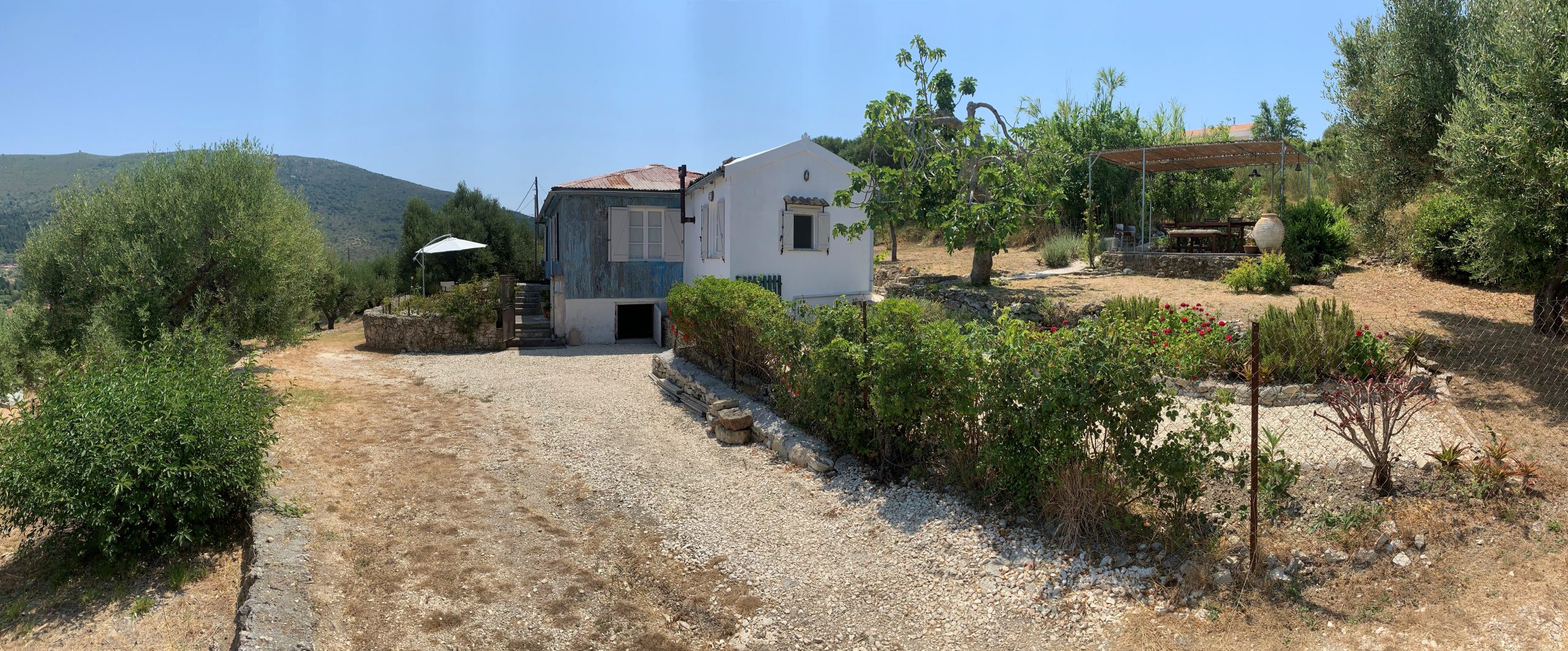 View from distance of house for sale Ithaca Greece, Ag. Saranta