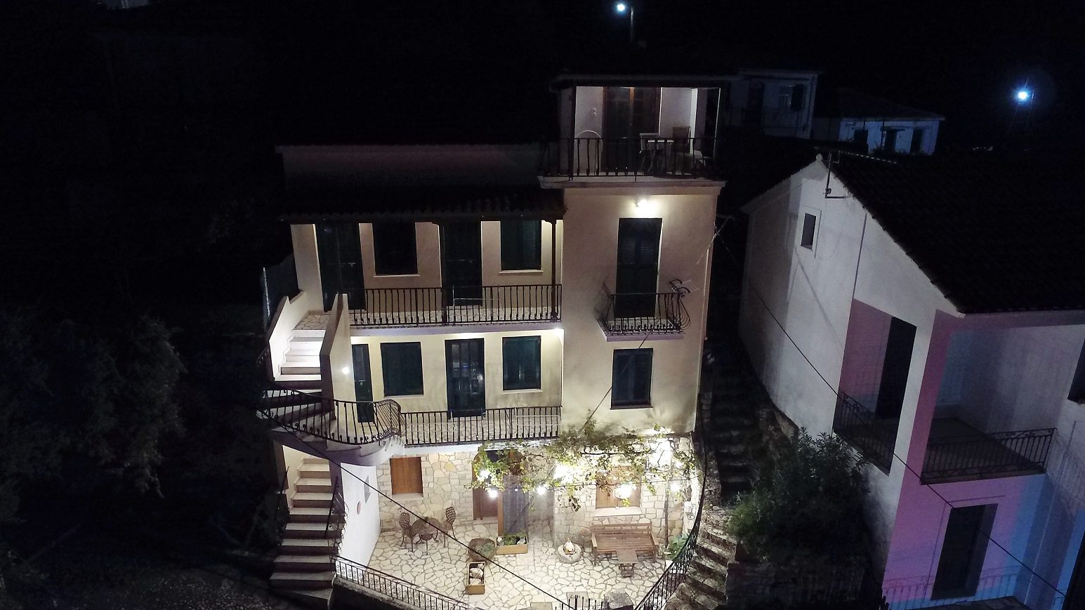 Night views of apartment complex and house for sale in Ithaca Greece, Kioni
