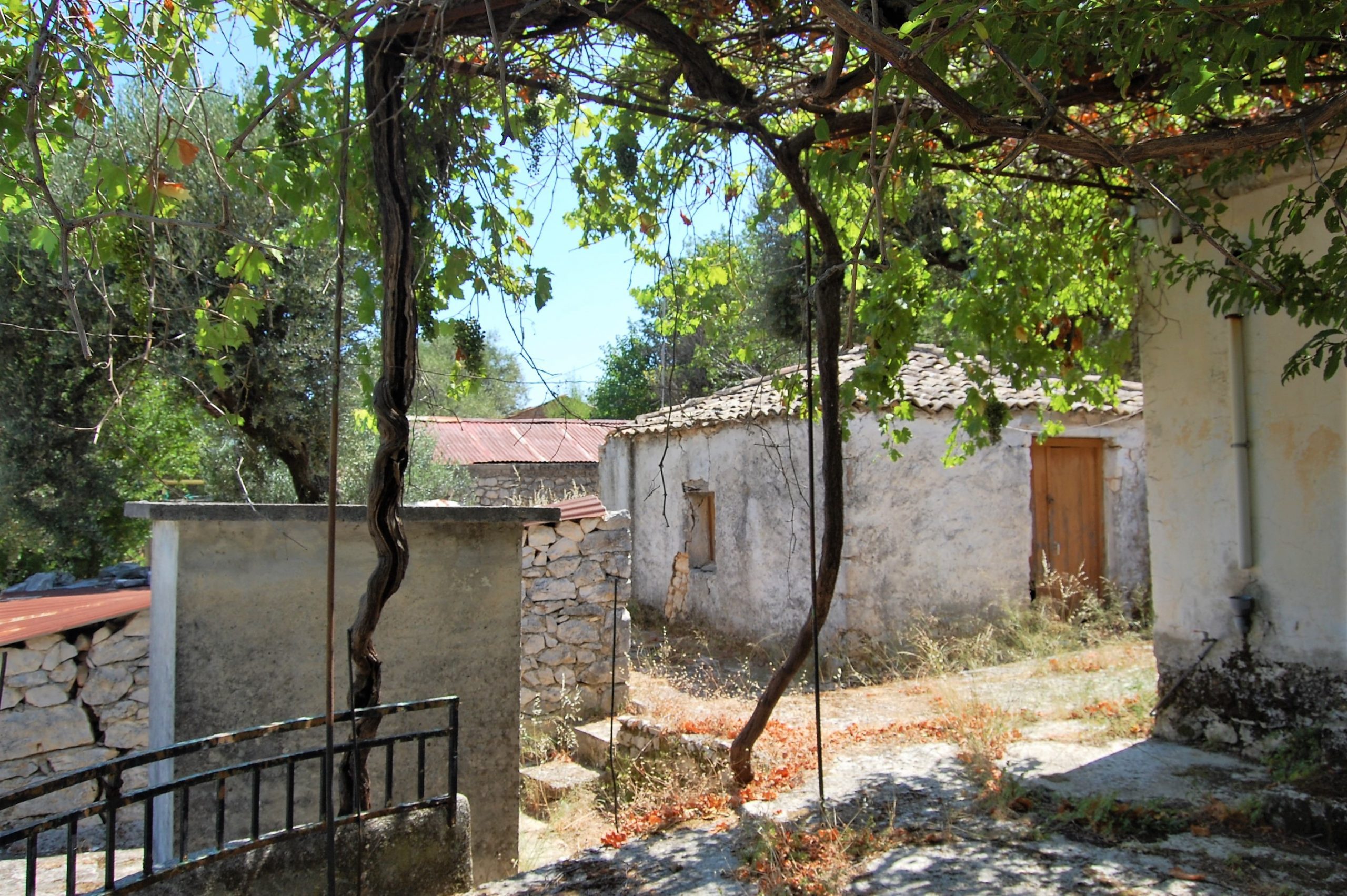 Back exterior of house for sale in Ithaca Greece, Perachori