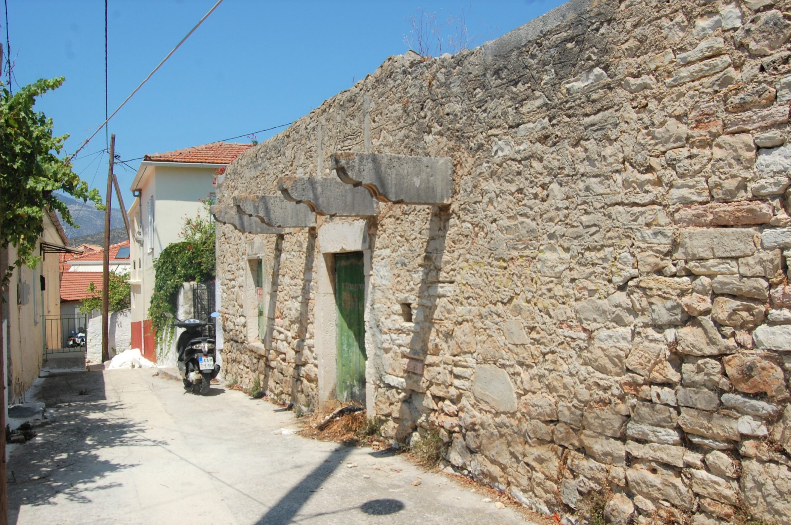 Exterior facade and terrace of ruin for sale in Ithaca Greece, Vathi