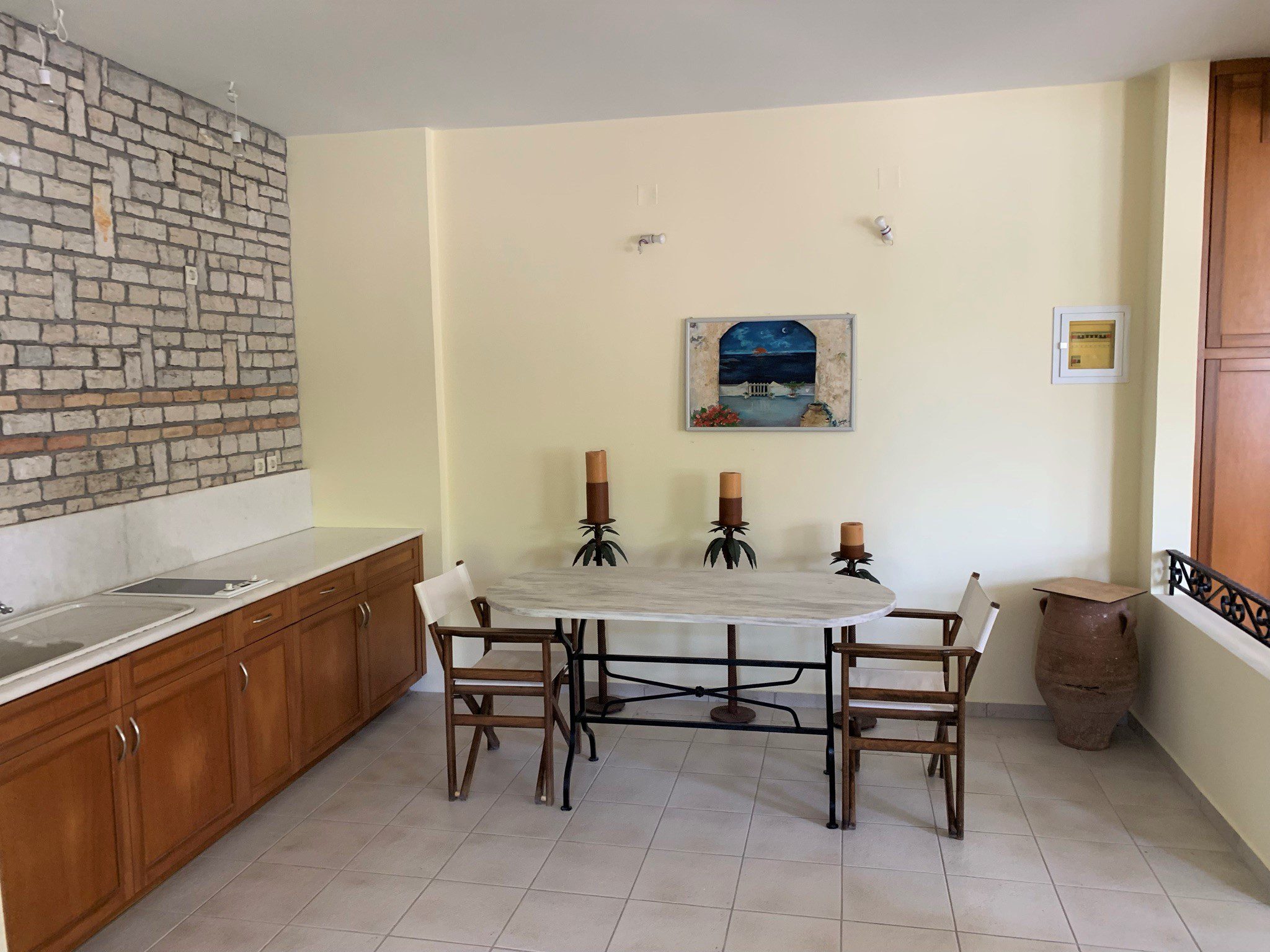 Dining area of studio below house for sale Ithaca Greece, Aetos