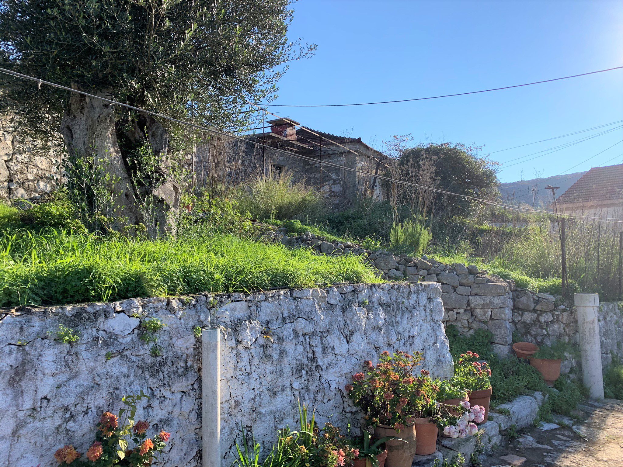 Stone walls around the house for sale on Ithaca Greece, Vathi