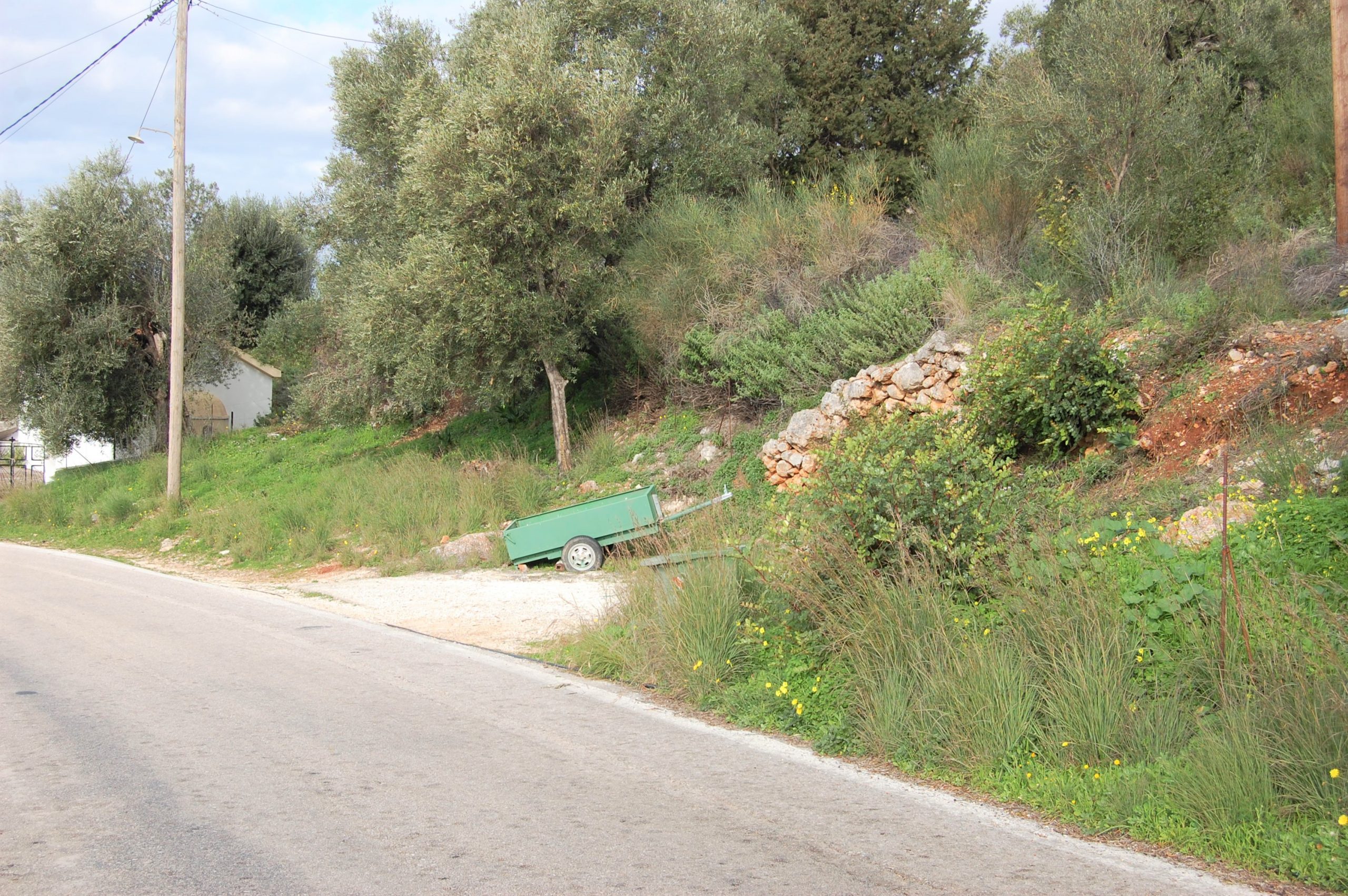 Road between plots of land for sale on Ithaca Greece, Lefki