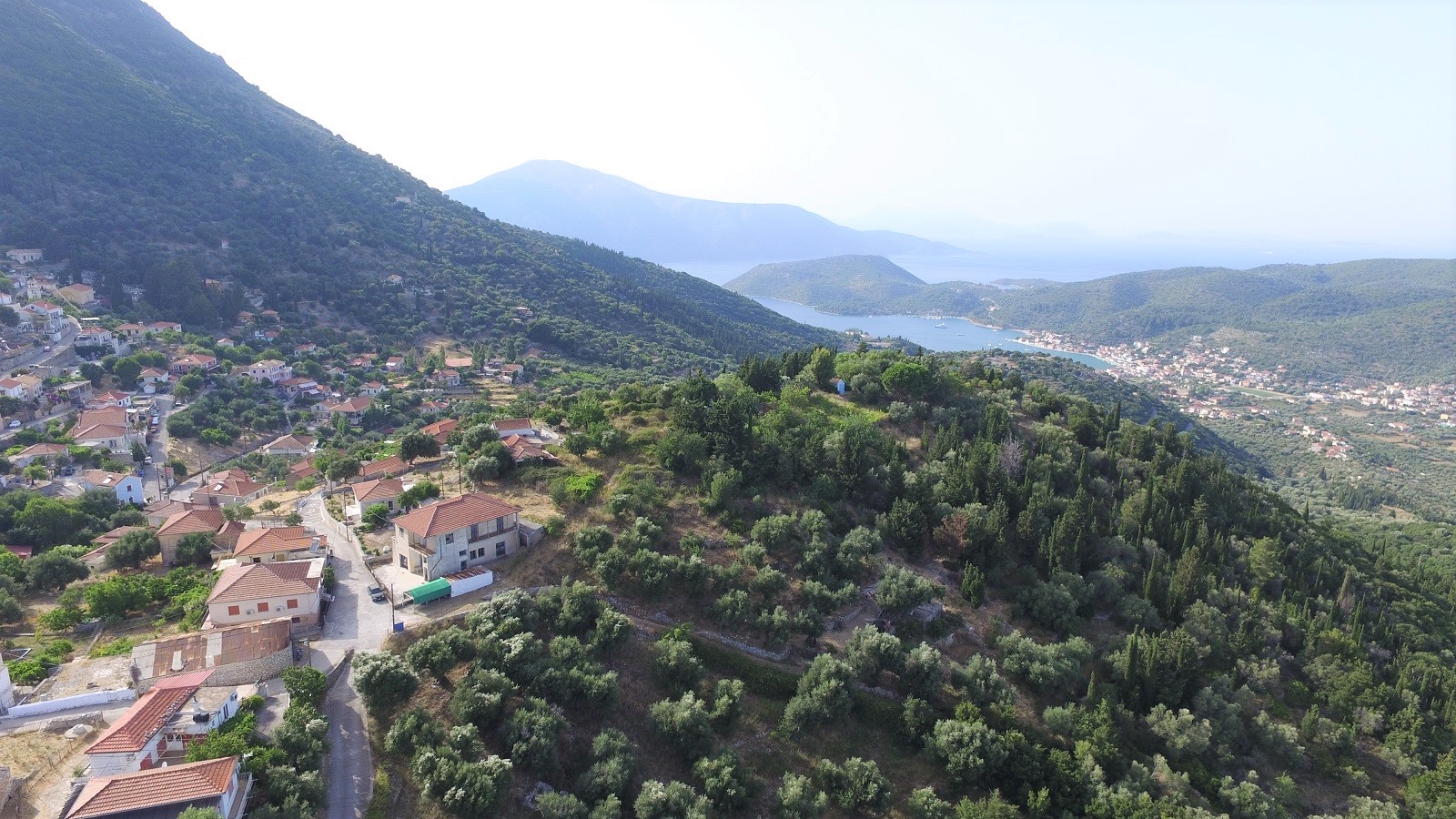 Aerial views of land with ruin for sale on Ithaca Greece, Perachori