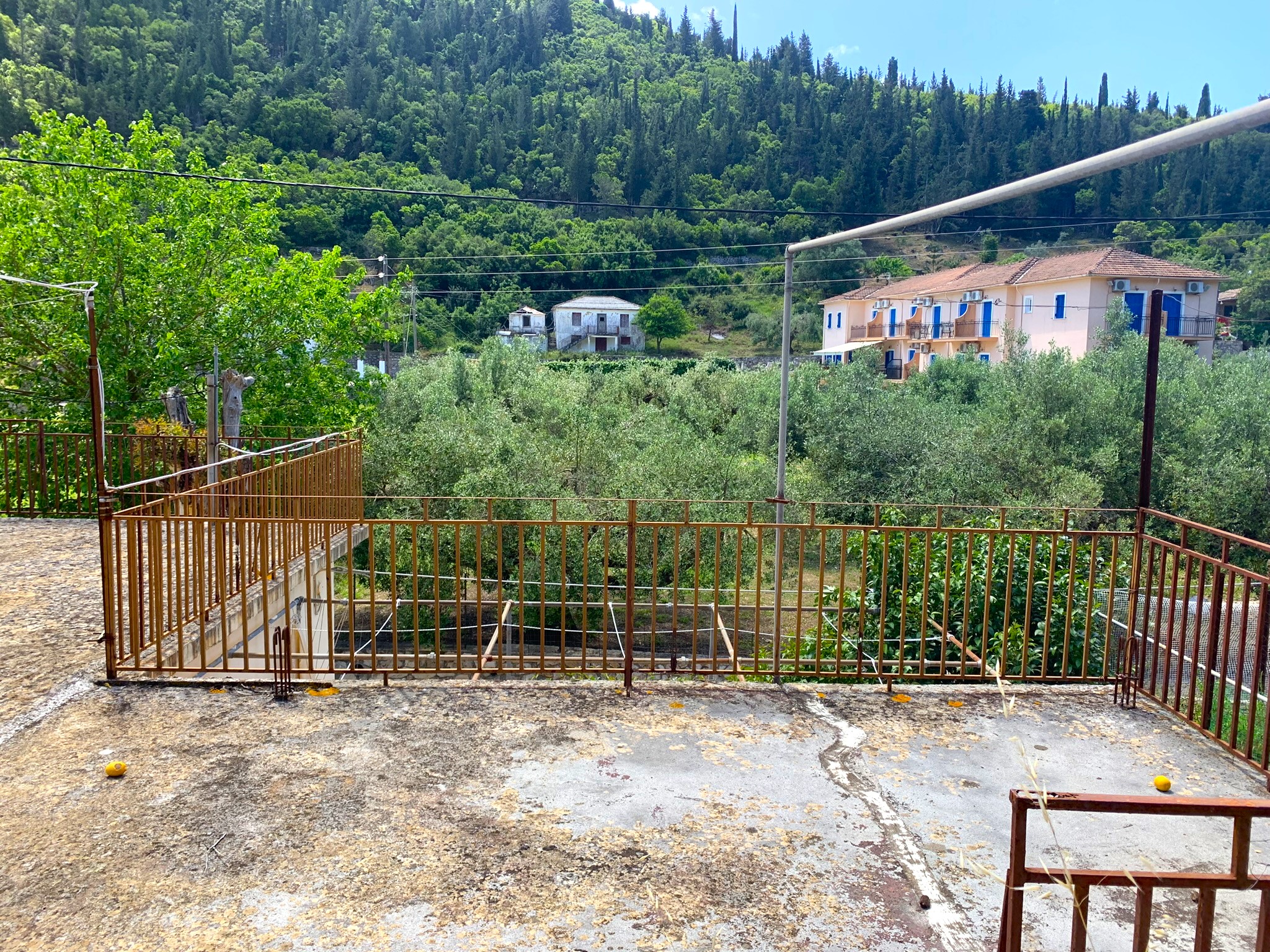 Outdoor spaces and views of house for sale on Ithaca Greece, Frikes