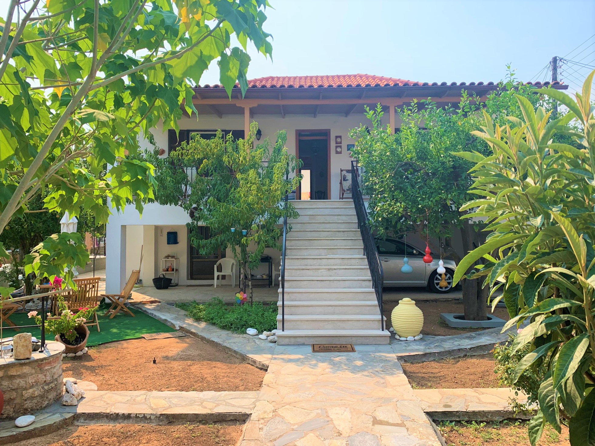 External stairs leading to main entrance of house for sale on Ithaca Greece, Vathi