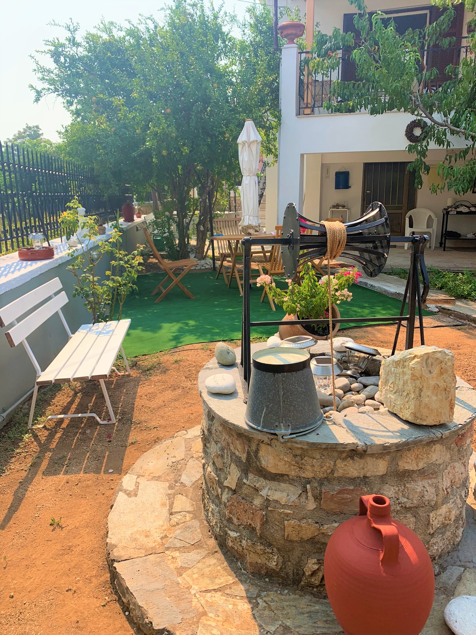 Patio with water well of house for sale on Ithaca Greece, Vathi