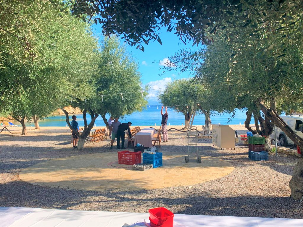 preparing the setting for Birthday party, Filiatro beach, Ithaca Greece