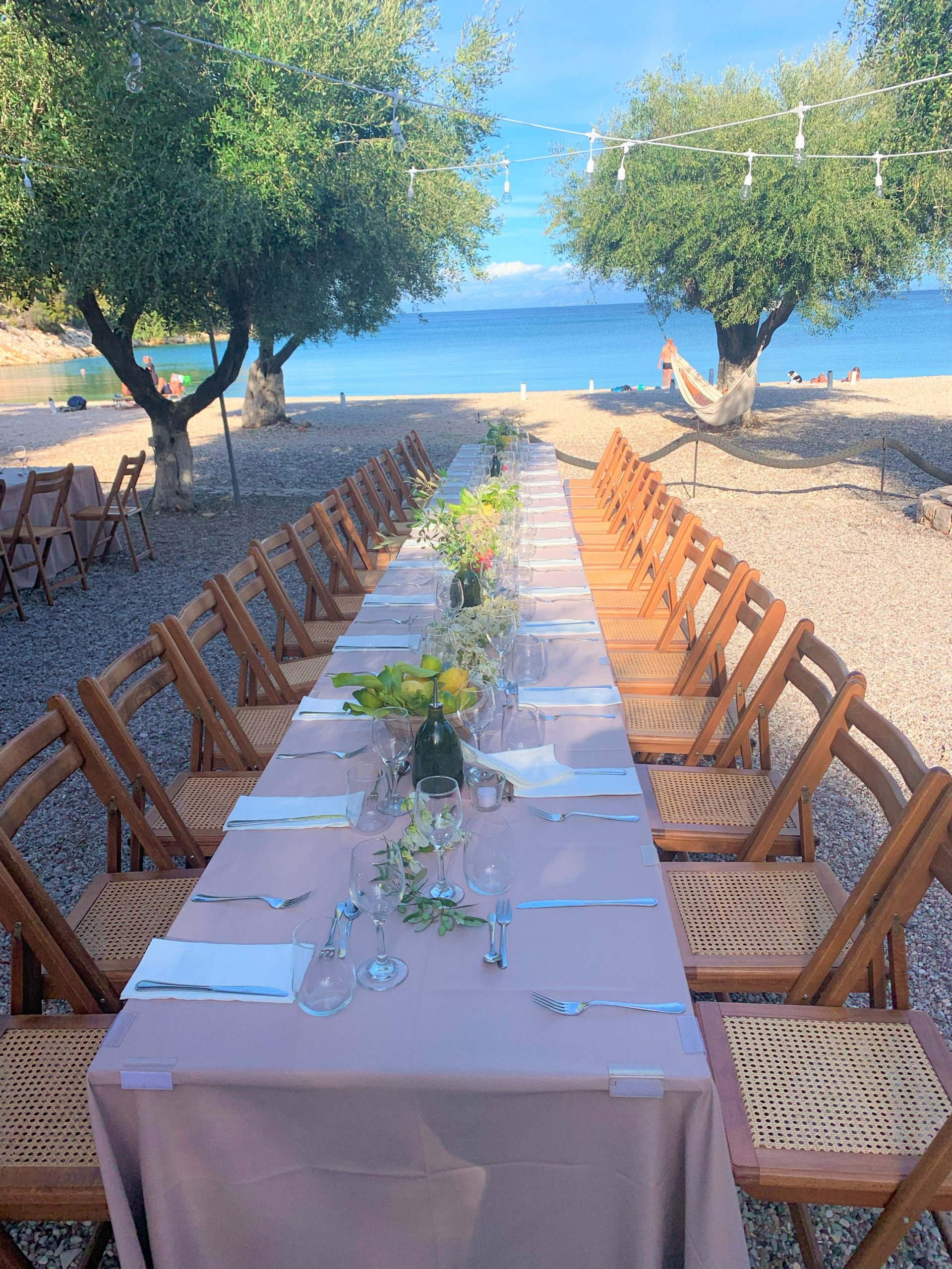 table setting at birthday party, Filiatro beach, Ithaca Greece