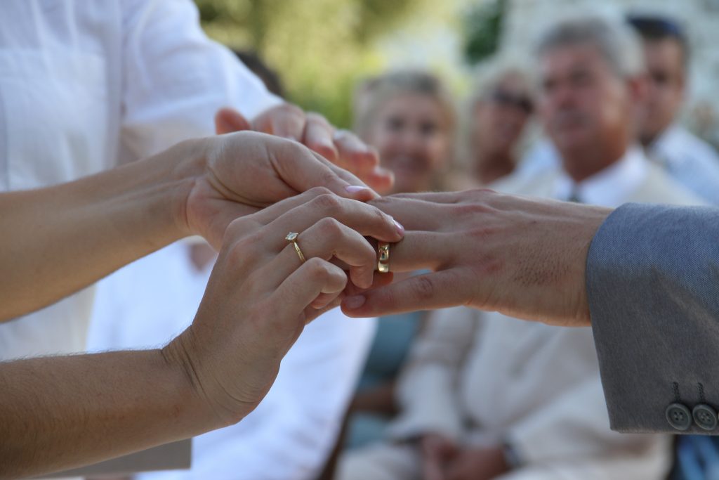 Wedding rings exchange at wedding on Ithaca Greece