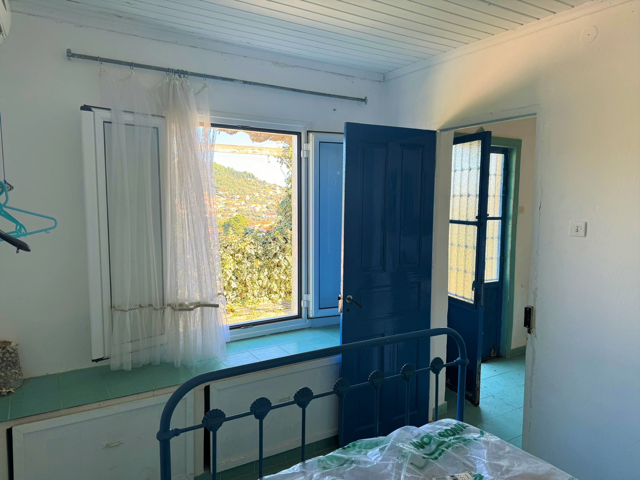 Bedroom and entrance of house for sale in Ithaca Greece, Vathi