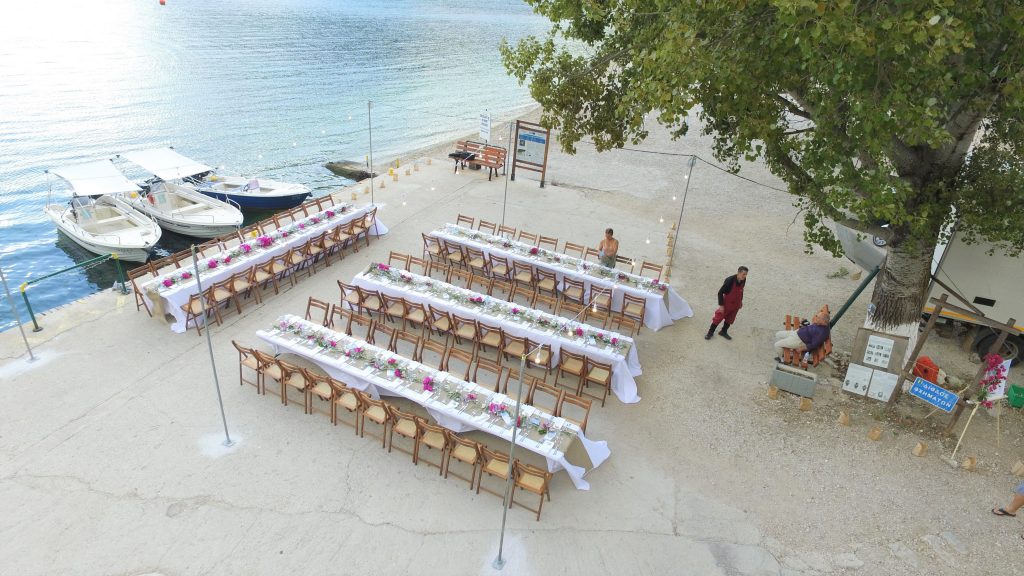 Drone pic, arrangements for wedding reception on seafront, Ithaca Greece