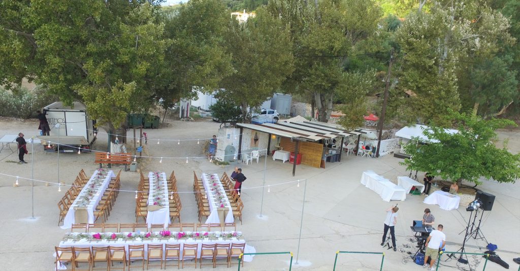 Drone pic, arrangements for wedding reception on seafront, Ithaca Greece