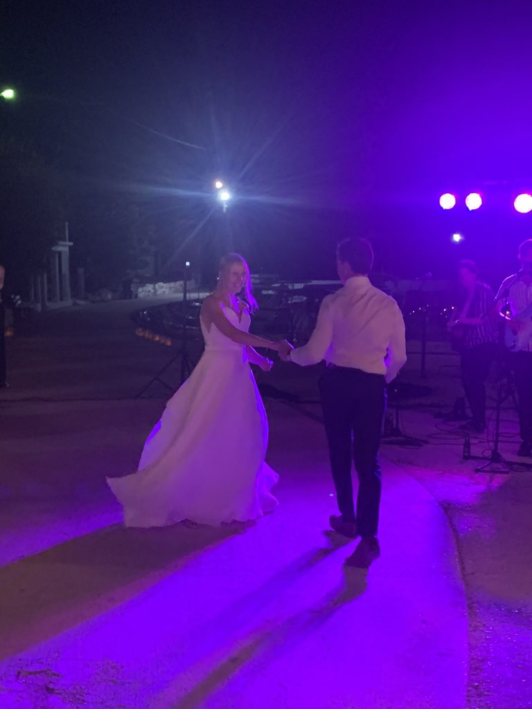Bride and groom dance, wedding reception at beach, Ithaca, Greece