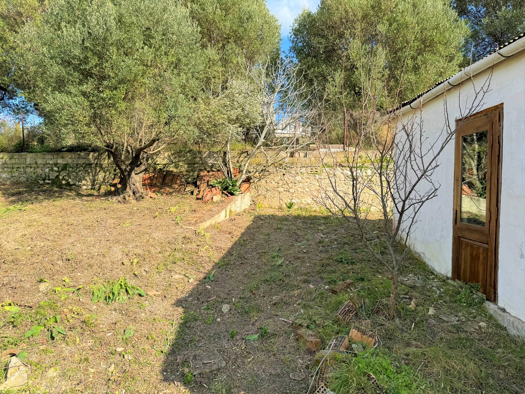 Garden views of house for sale in Ithaca Greece, Platrithya