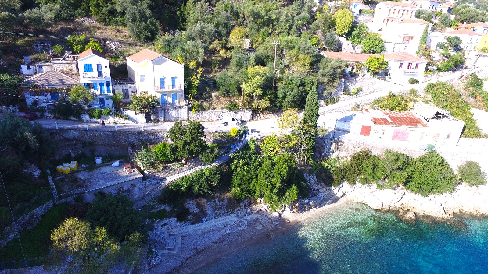 Aerial views with beach in front of ruin for sale in Ithaca Greece, Kioni