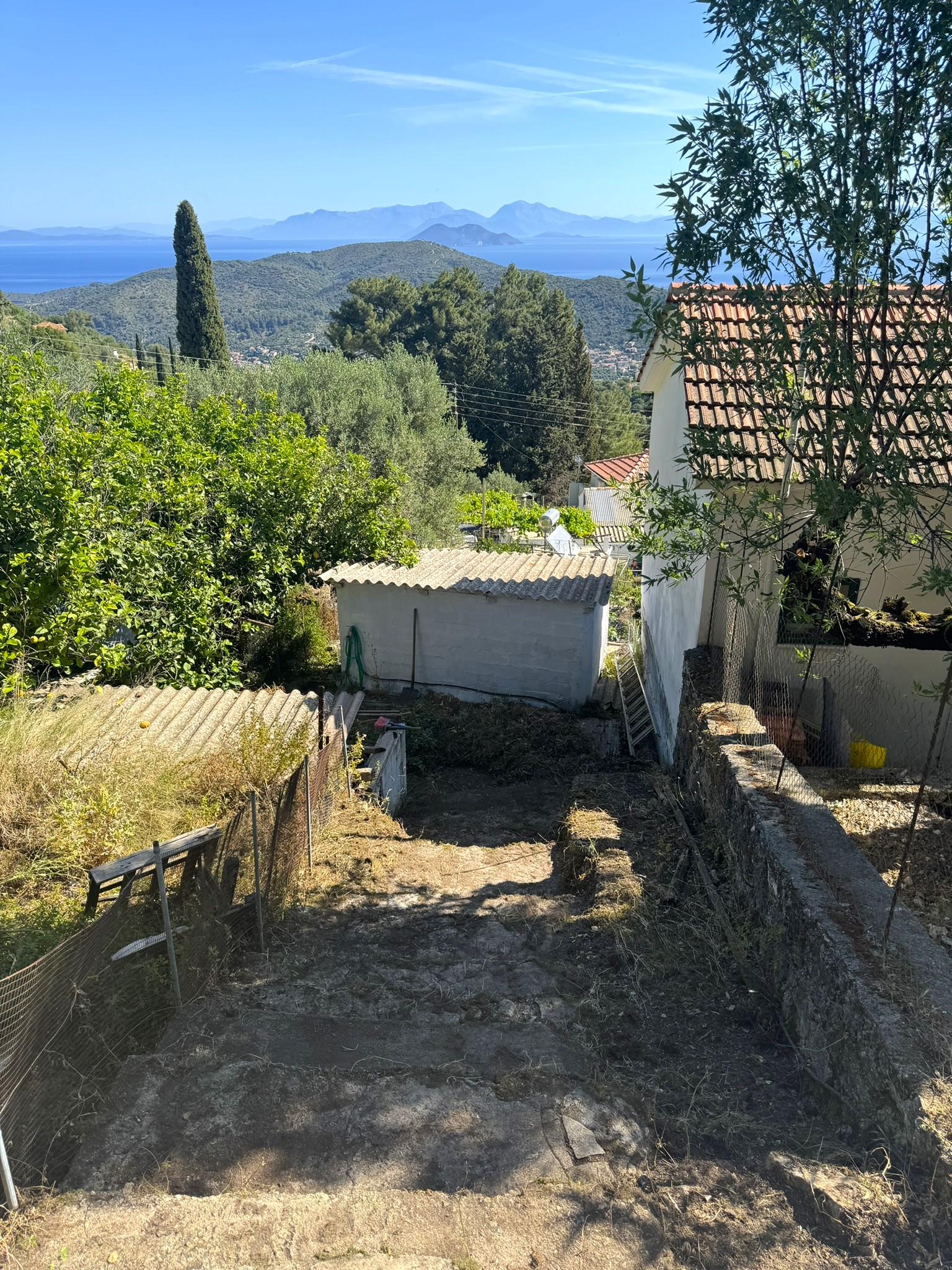 Path to storeroom of house for sale in Ithaca Greece Perachori