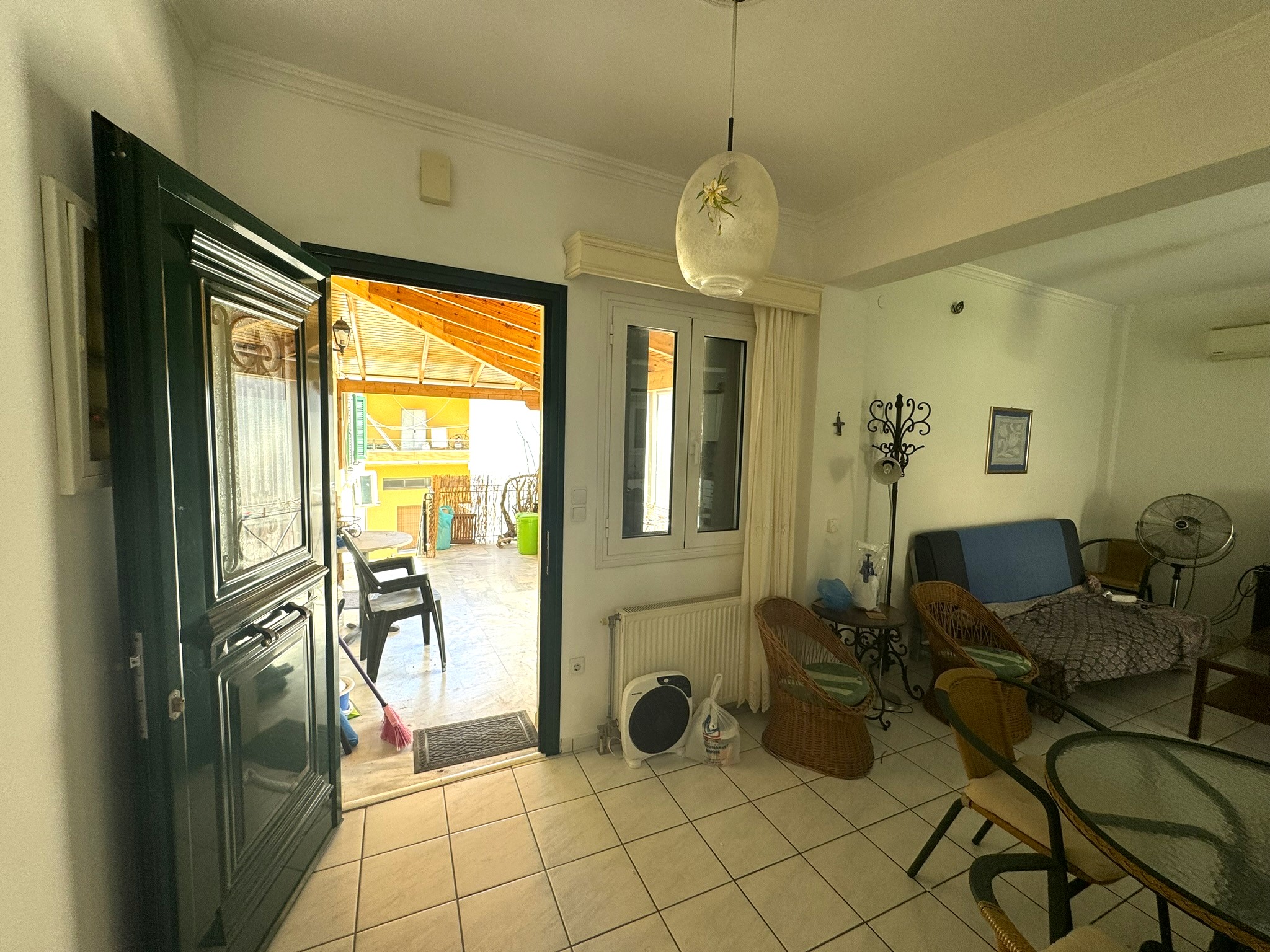 Lounge and front door of house for sale in Ithaca Greece Vathi