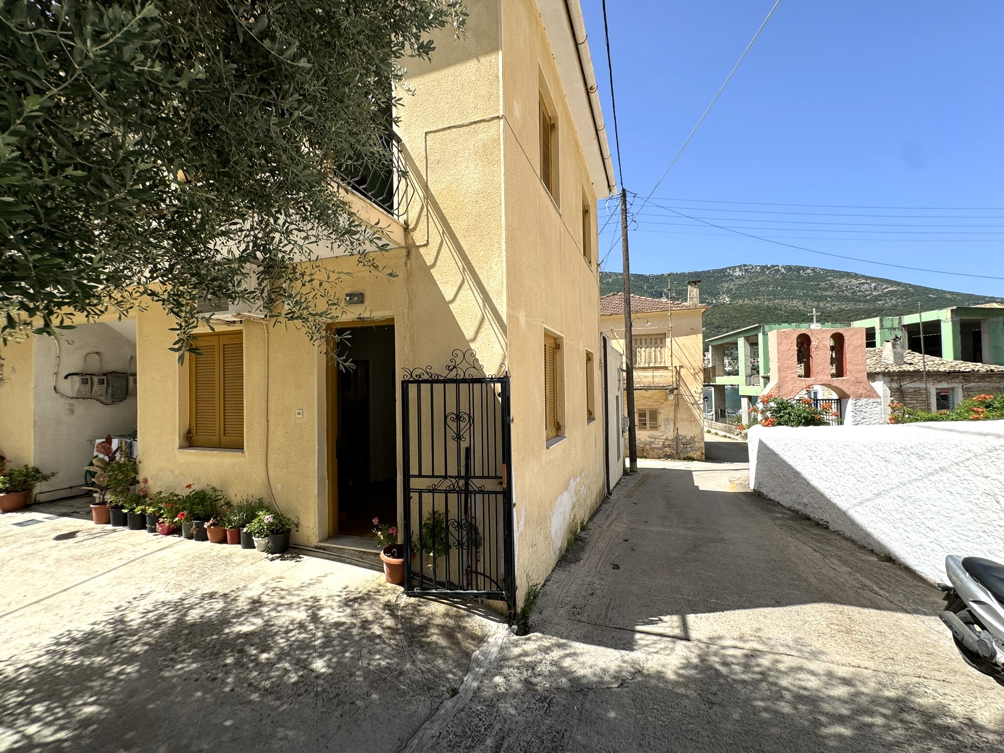 Road view of apartments for sale in Ithaca Greece Vathi