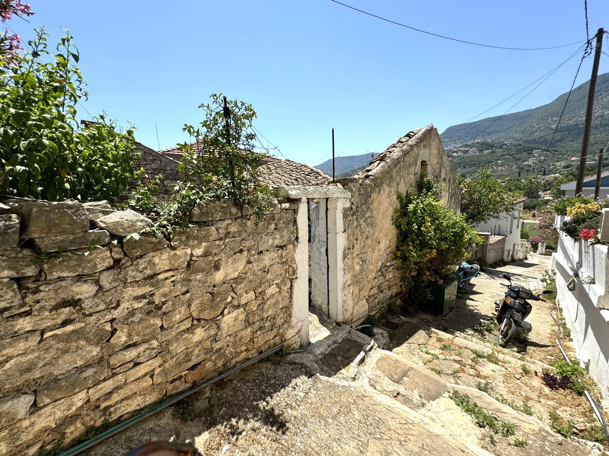 Public staircase and exterior of house for sale in Ithaca Greece Vathi