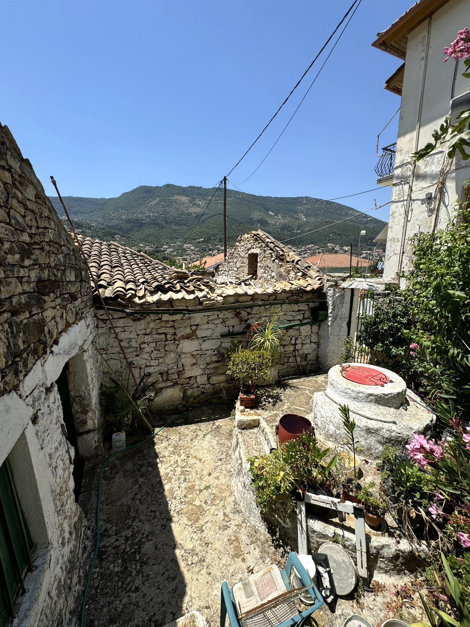 Outdoor space and water tank of house for sale in Ithaca Greece Vathi