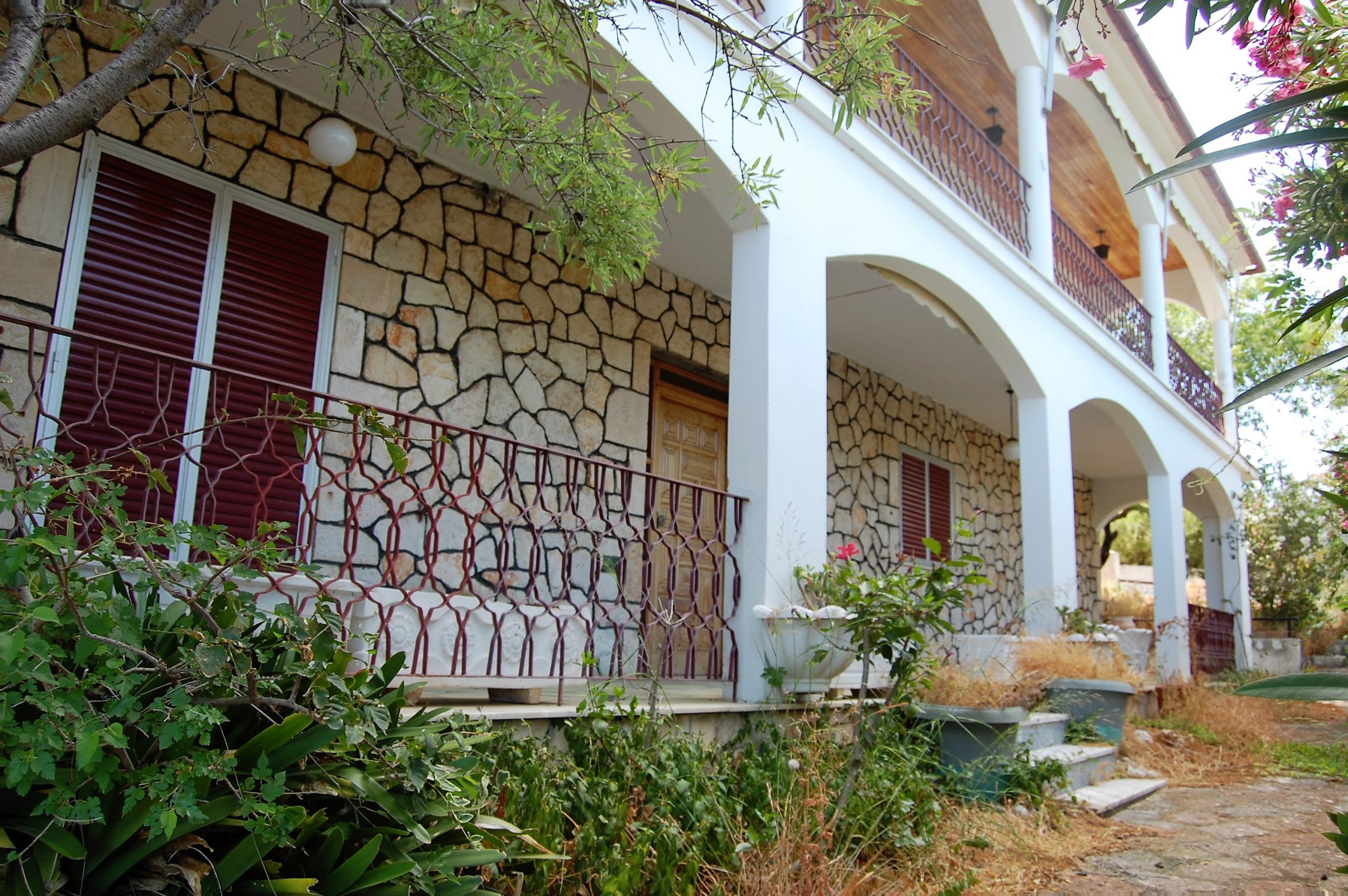 Facade of house for sale in Ithaca Greece Lefki